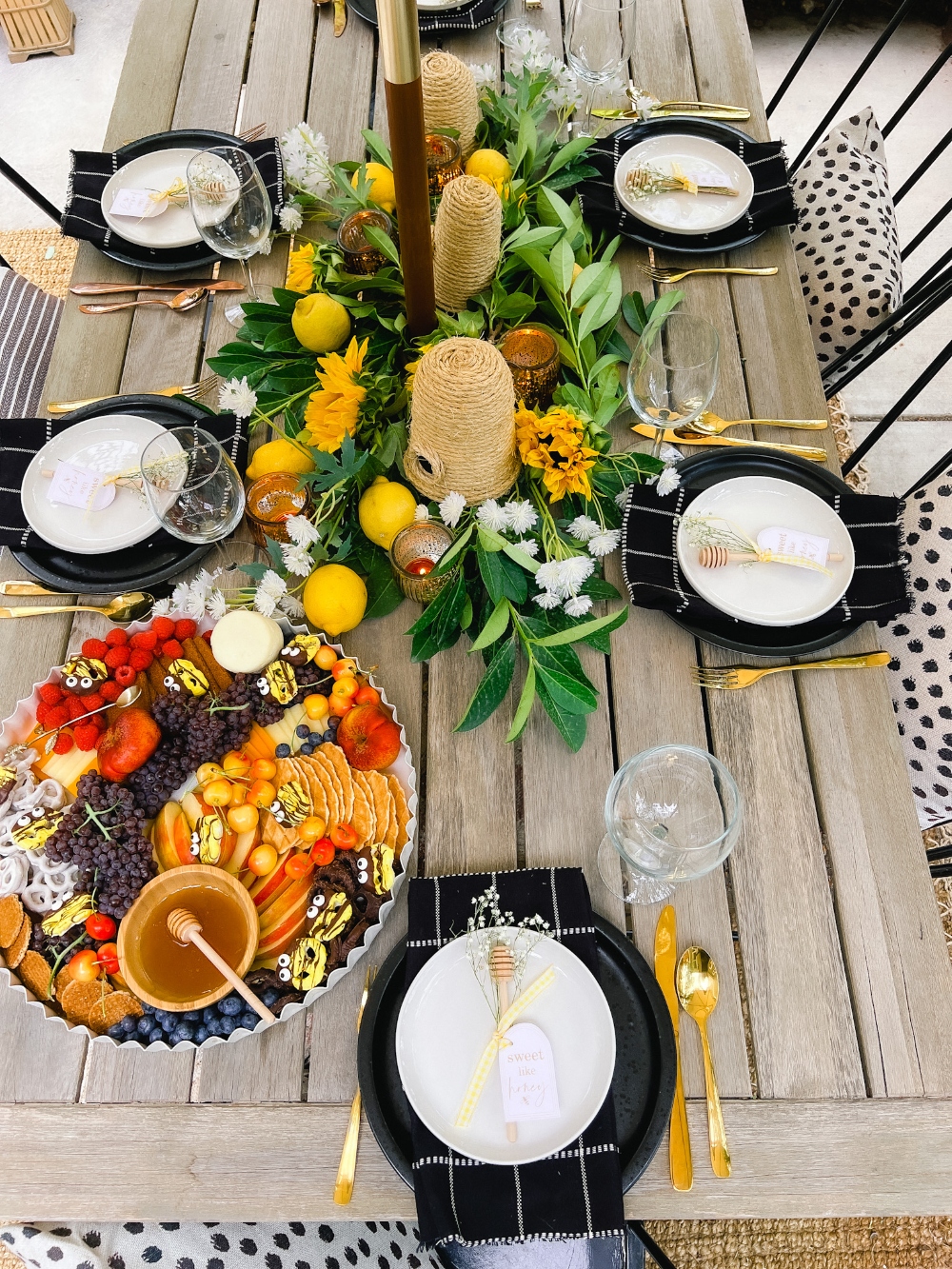 Summer Honey-Themed Outdoor Dining. Celebrate warm weather and summer with a honey-themed dinner, handmade beehives, honey dipper gift and bee-themed dessert board!