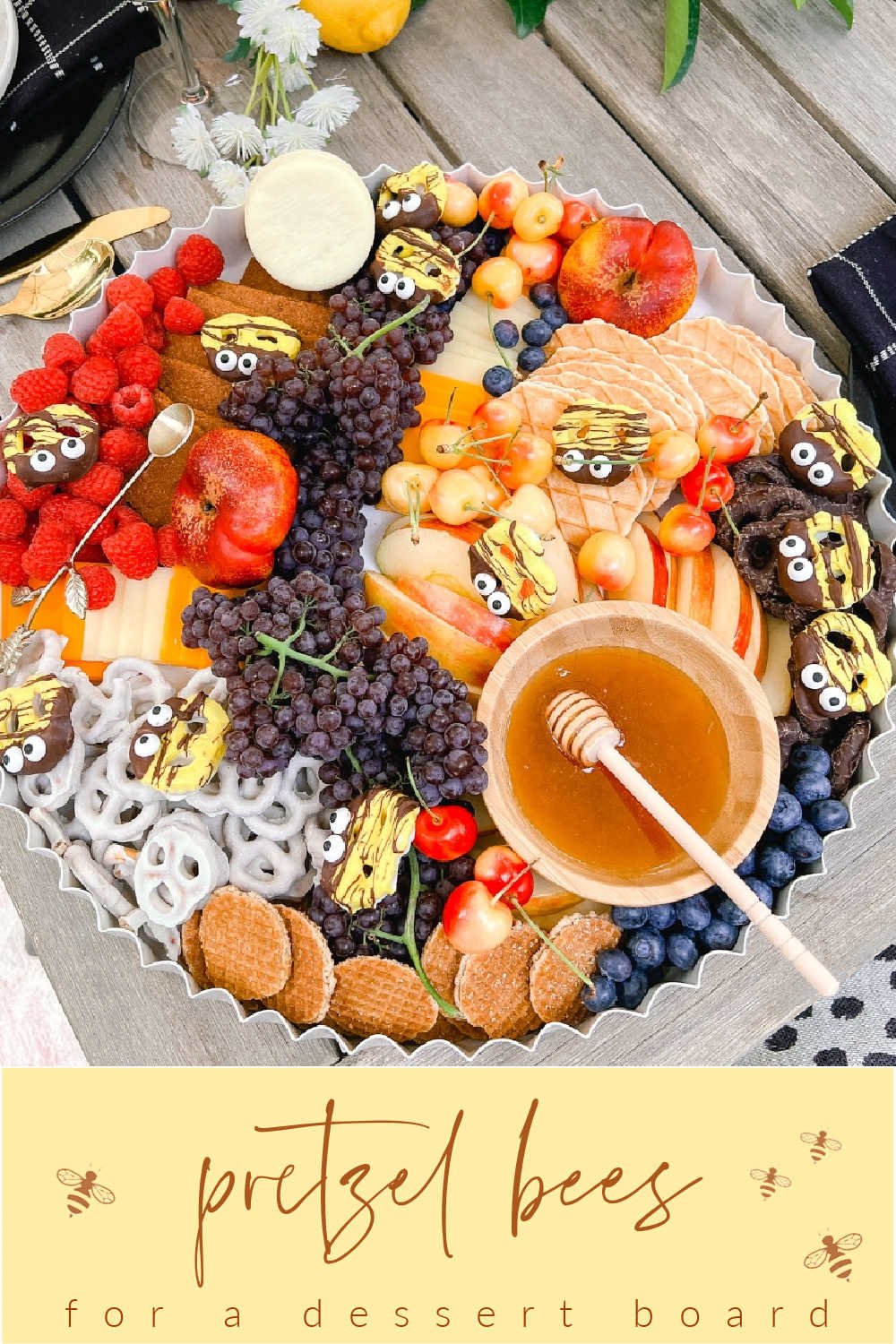 Honey-Themed Dessert Board with Pretzel Bees. Create a whimsical and delicious dessert board with sweet fruits, snacks and adorable pretzel bees.  