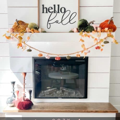 Fall Mantel and DIY Yarn Pumpkins. Create a cozy layered mantel with a beautiful fall sign, foliage, vibrant fall pumpkins and A matching DIY yarn pumpkin garland!