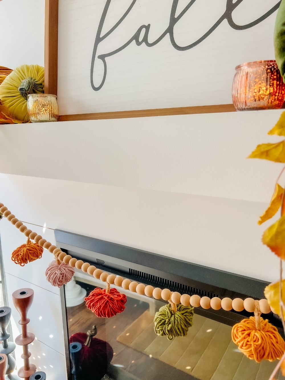 all Mantel and DIY Yarn Pumpkin Garland. Create a cozy layered mantel with a beautiful fall sign, foliage, vibrant fall pumpkins and A matching DIY yarn pumpkin garland! 