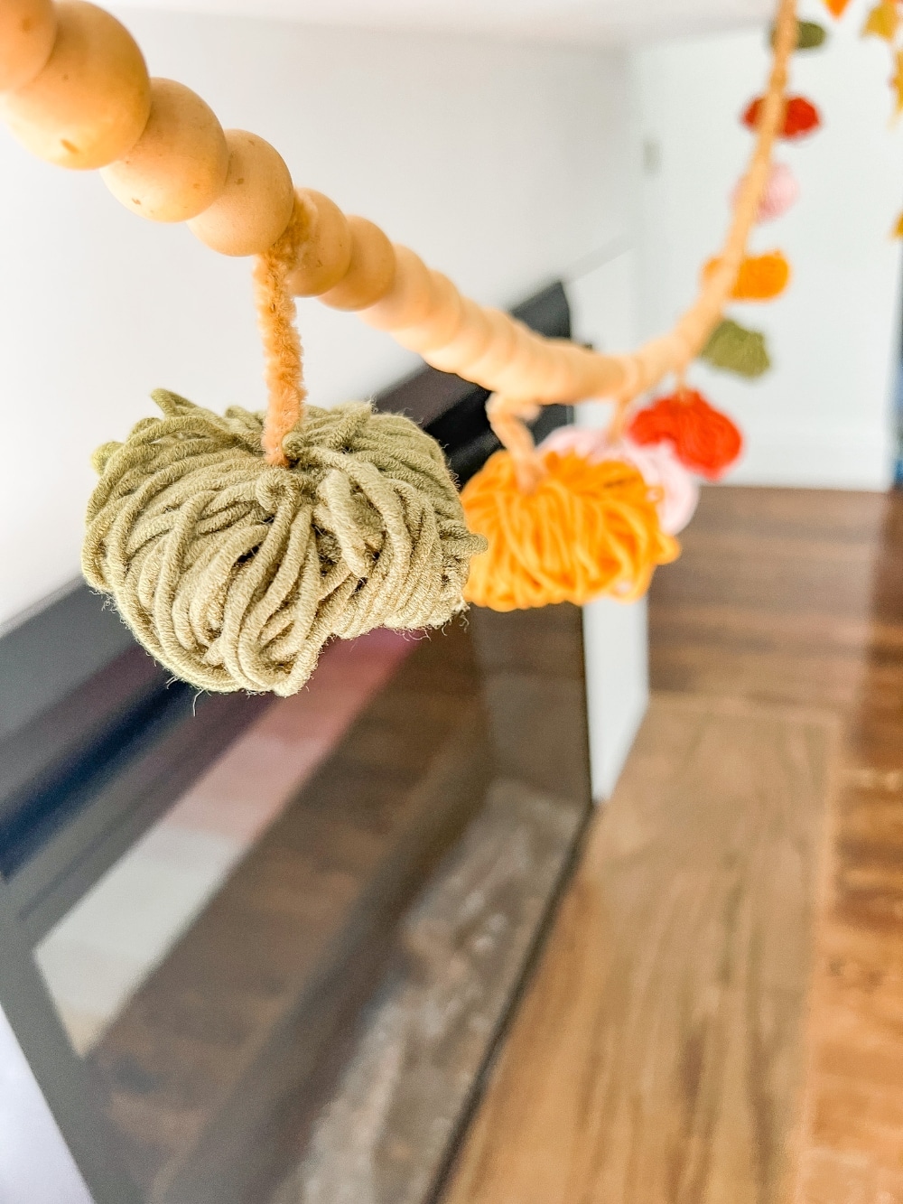 all Mantel and DIY Yarn Pumpkin Garland. Create a cozy layered mantel with a beautiful fall sign, foliage, vibrant fall pumpkins and A matching DIY yarn pumpkin garland! 