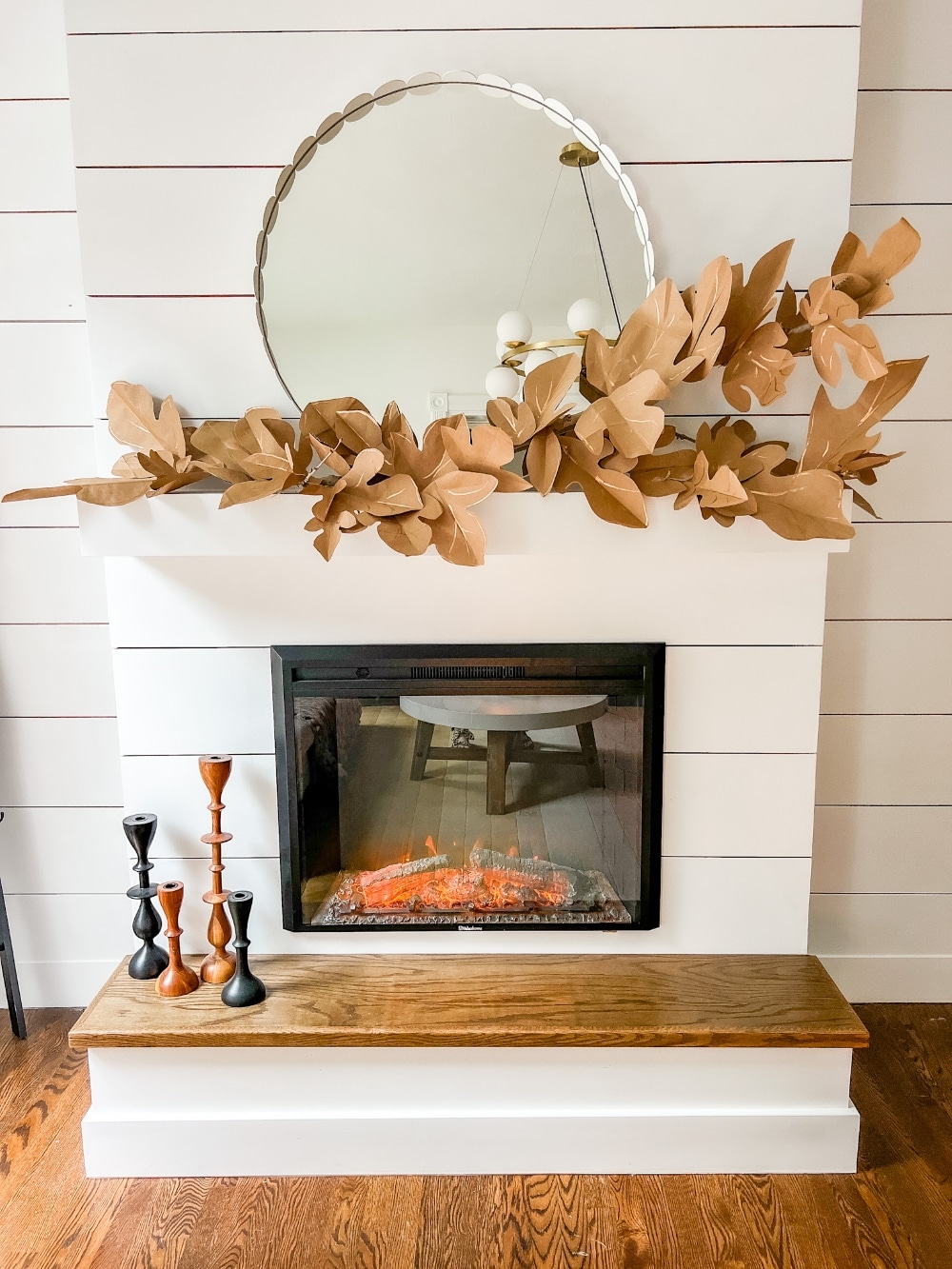 Paper Bag Leaf Garland. Upcycle your old paper grocery store bags into a warm and vibrant paper leaf garland for a mantel or shelf for Fall! 