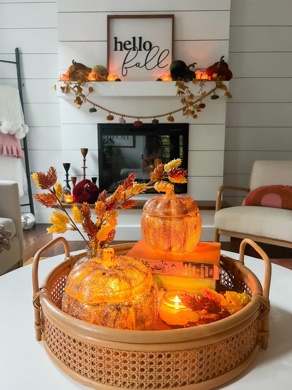 Pottery Barn Inspired Amber Pumpkin Cloches. Turn inexpensive glass pumpkin containers into high end looking cloches by painting and adding glitter! 