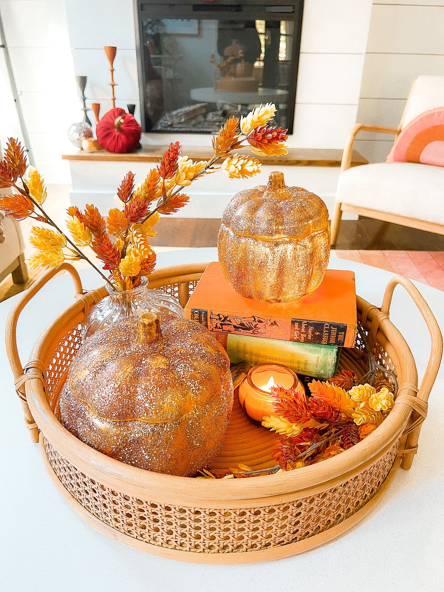 Pottery Barn Inspired Amber Pumpkin Cloches. Turn inexpensive glass pumpkin containers into high end looking cloches by painting and adding glitter! 