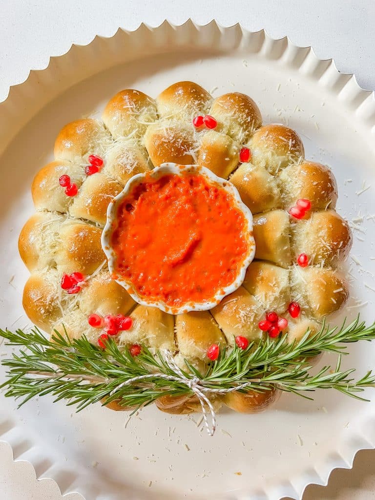 Holiday Cheesy Pull-Apart Bread Wreath. Golden rolls with a cheesy filling a perfect appetizer for holiday parties or for a night at home.