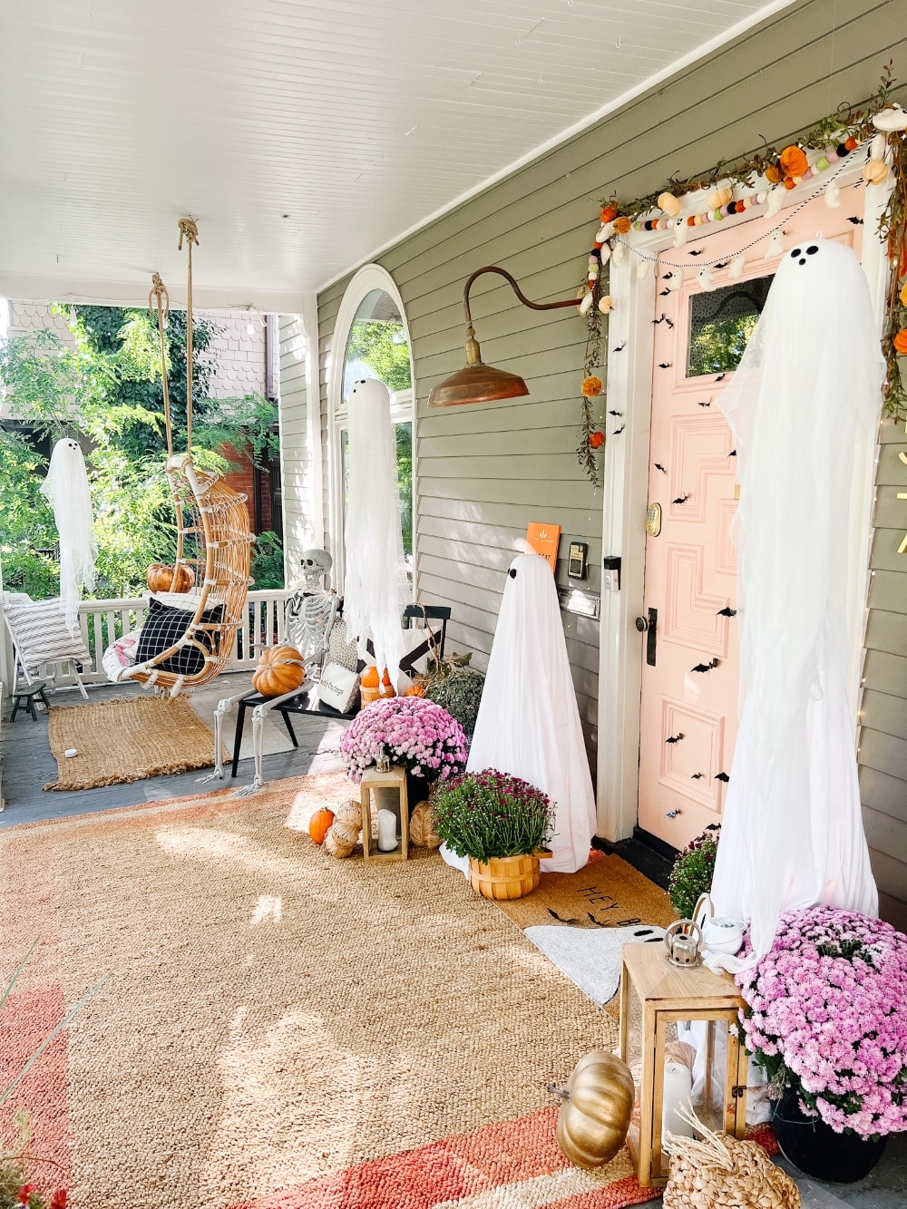 Easy Halloween Ghost Porch. Create tomato cage ghost luminaries, floating ghost luminaries and a ghost doormat for spooky fun!