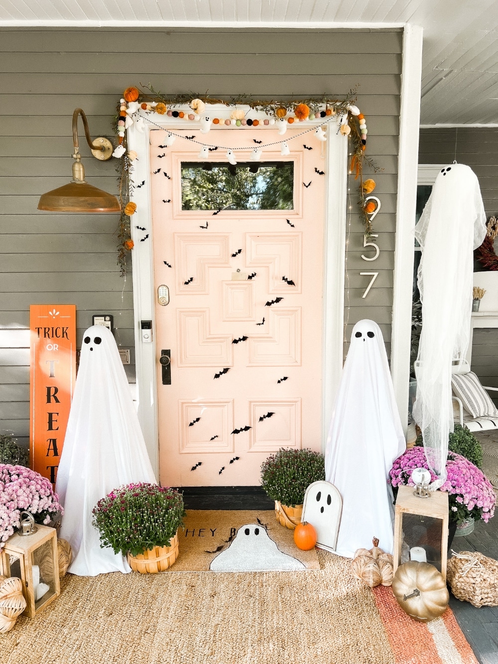 Easy Halloween Ghost Porch. Create tomato cage ghost luminaries, floating ghost luminaries and a ghost doormat for spooky fun!