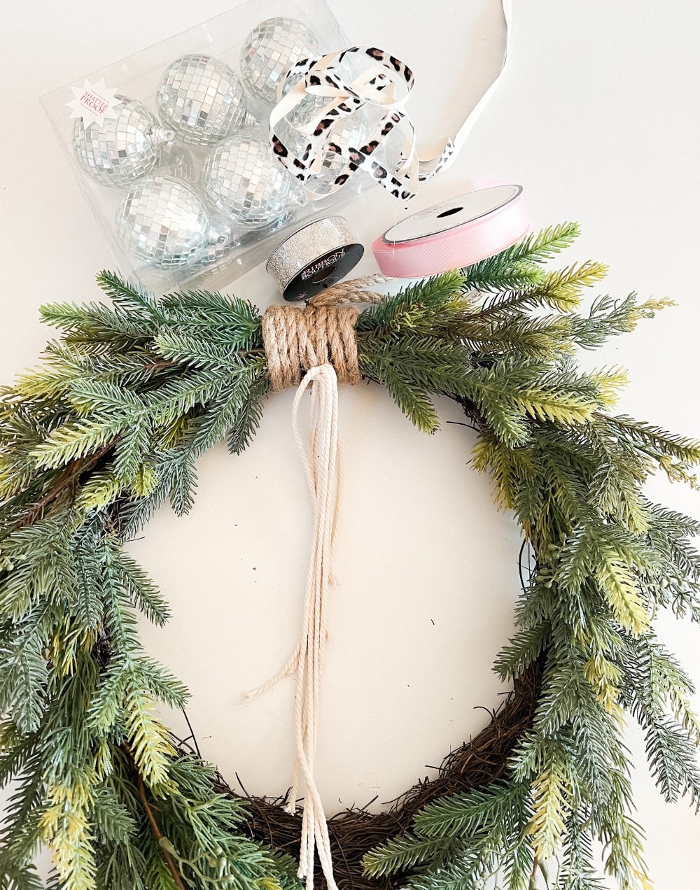 Holiday Evergreen Disco Ball Wreath. Celebrate the holidays with this sparkly, festive disco ball wreath. It's also great to keep up through New Year's Eve!