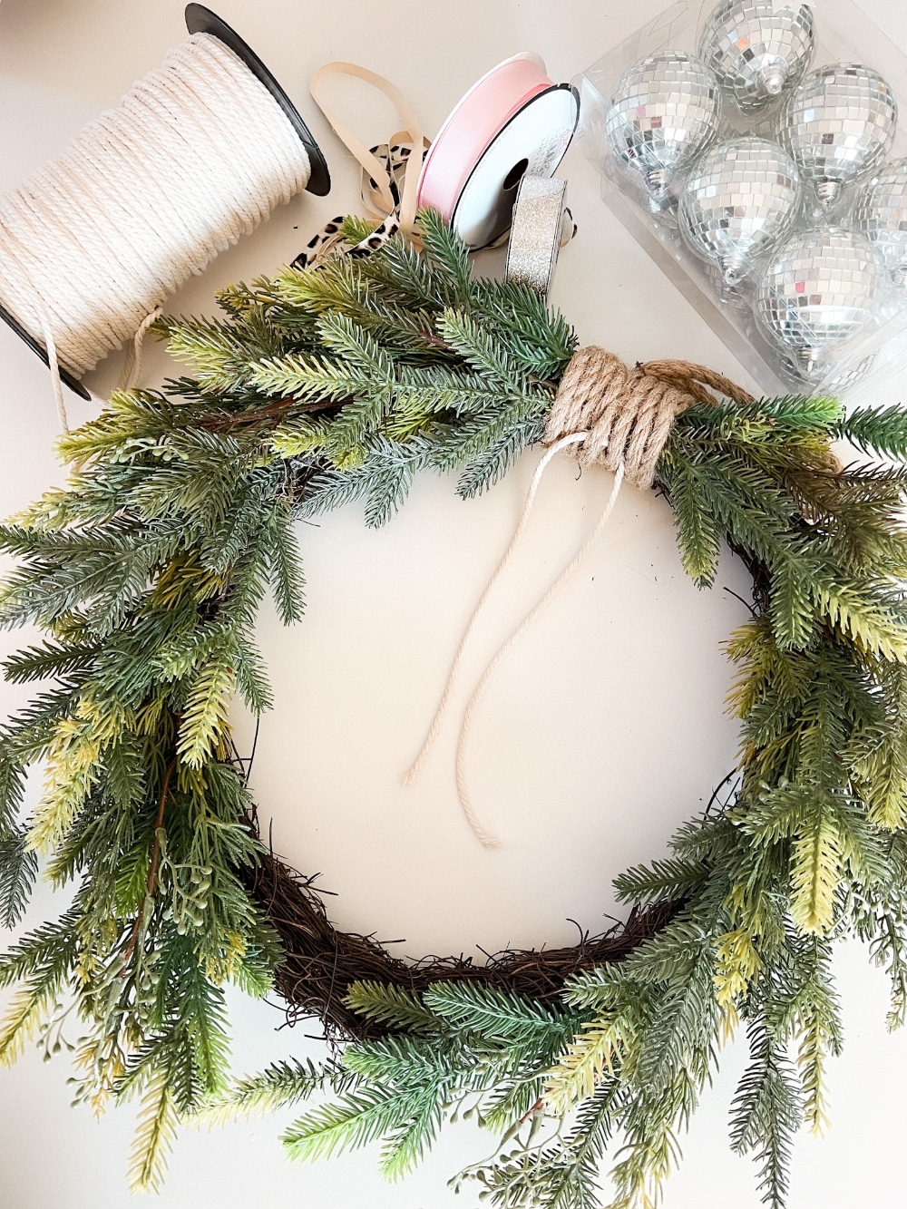Holiday Evergreen Disco Ball Wreath. Celebrate the holidays with this sparkly, festive disco ball wreath. It's also great to keep up through New Year's Eve!