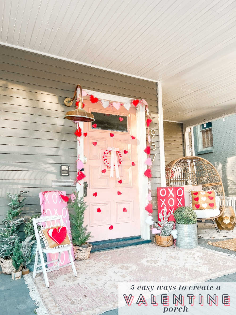 Easy DIY Valentine's Day Porch. Create a lovely Valentine porch with a homemade garland, painted signs, pillows and an easy DIY wreath. 