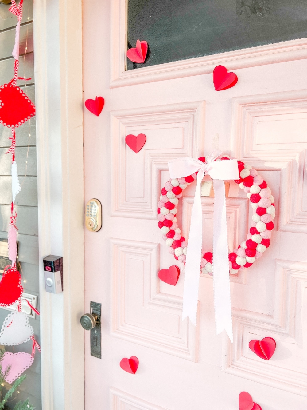 Easy DIY Valentine's Day Porch. Create a lovely Valentine porch with a homemade garland, painted signs, pillows and an easy DIY wreath. 