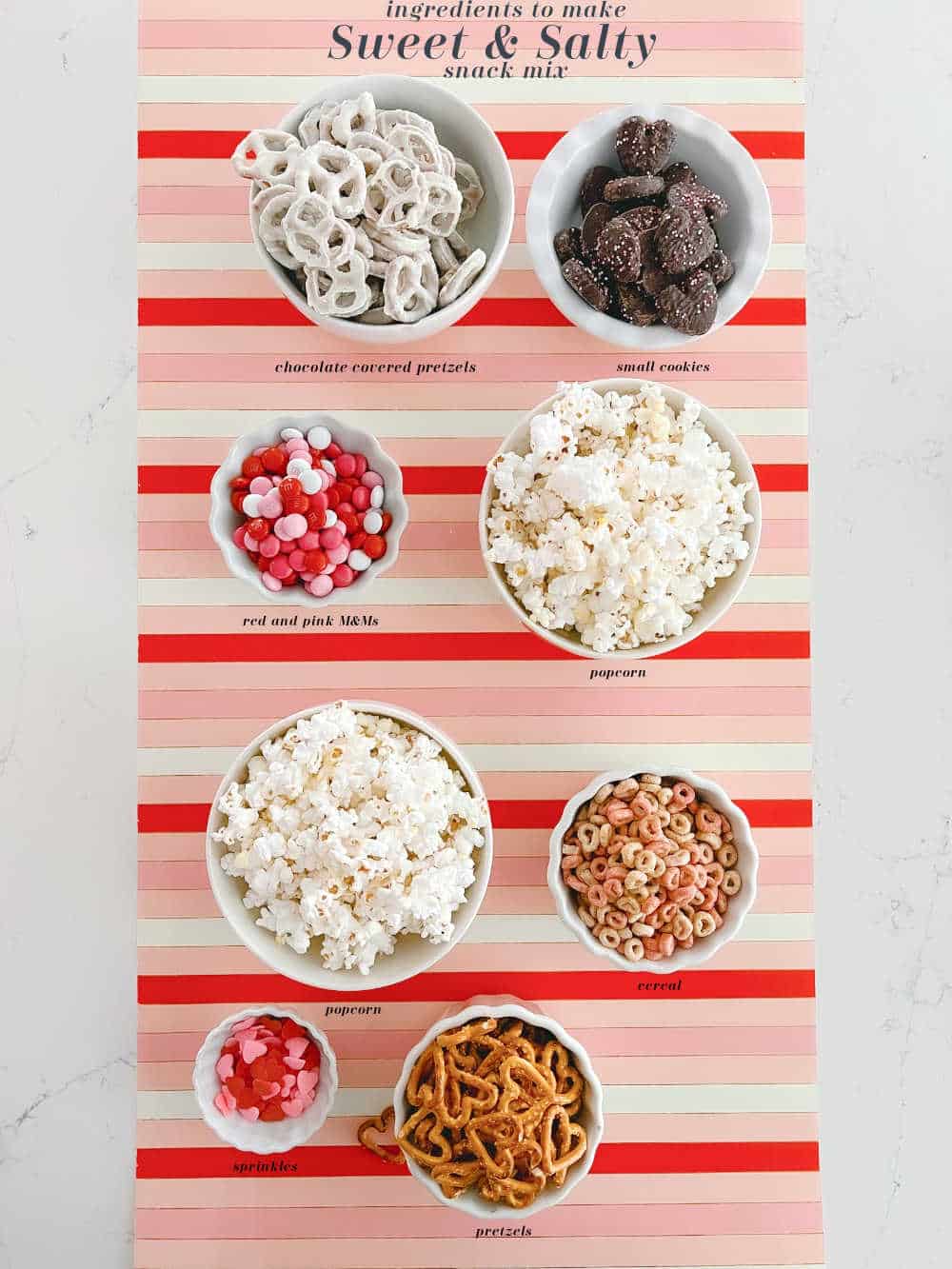 Sweet and Salty Valentine Snack Mix. Celebrate Valentine's Day this month with this yummy mix of pretzels, white chocolate, popcorn and candy. It's perfect for movie night, neighbor gifts or a lunch time snack! 