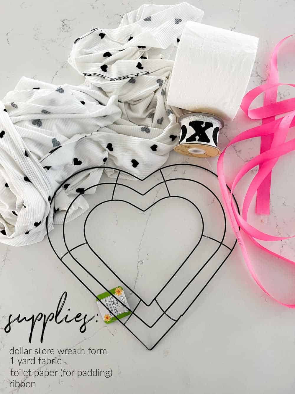 Dollar Store Valentine Heart Wreath. Grab a dollar store heart wreath form and turn it into an adorable wreath for Valentine's Day!