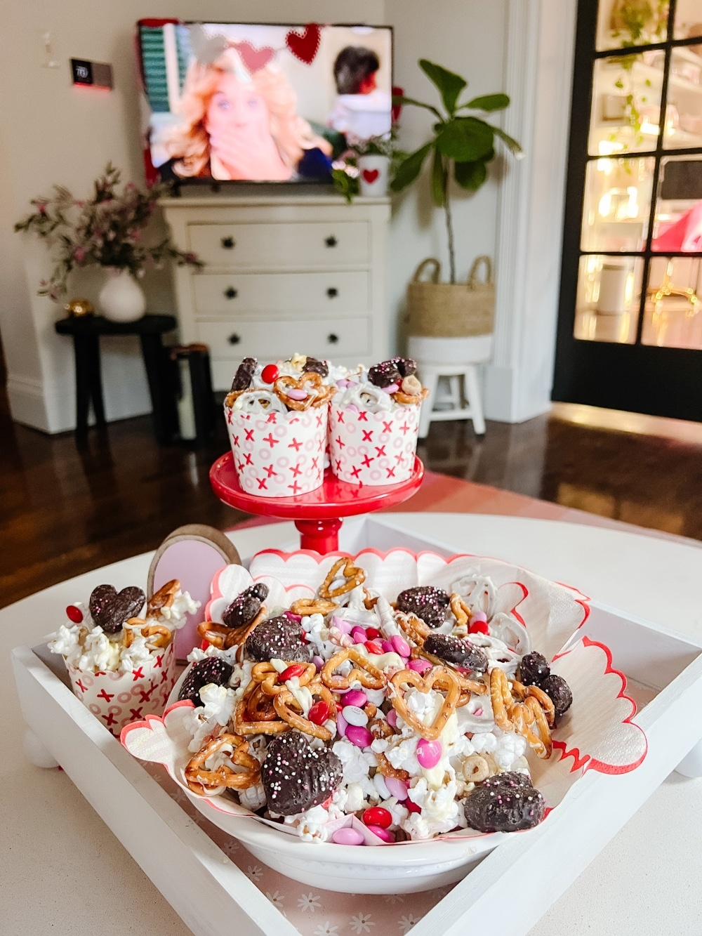 Sweet and Salty Valentine Snack Mix. Celebrate Valentine's Day this month with this yummy mix of pretzels, white chocolate, popcorn and candy. It's perfect for movie night, neighbor gifts or a lunch time snack! 