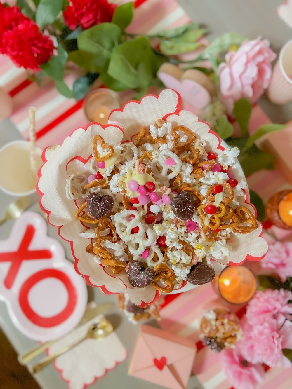Sweet and Salty Valentine Snack Mix. Celebrate Valentine's Day this month with this yummy mix of pretzels, white chocolate, popcorn and candy. It's perfect for movie night, neighbor gifts or a lunch time snack! 