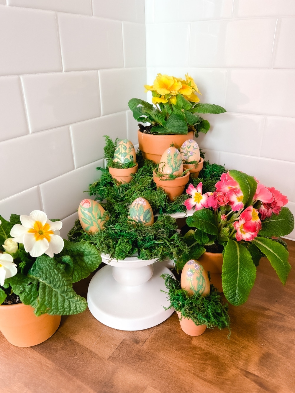 Hand Painted Herb Eggs Centerpiece. Create a sweet herb centerpiece by painting wooden eggs with different herbs!