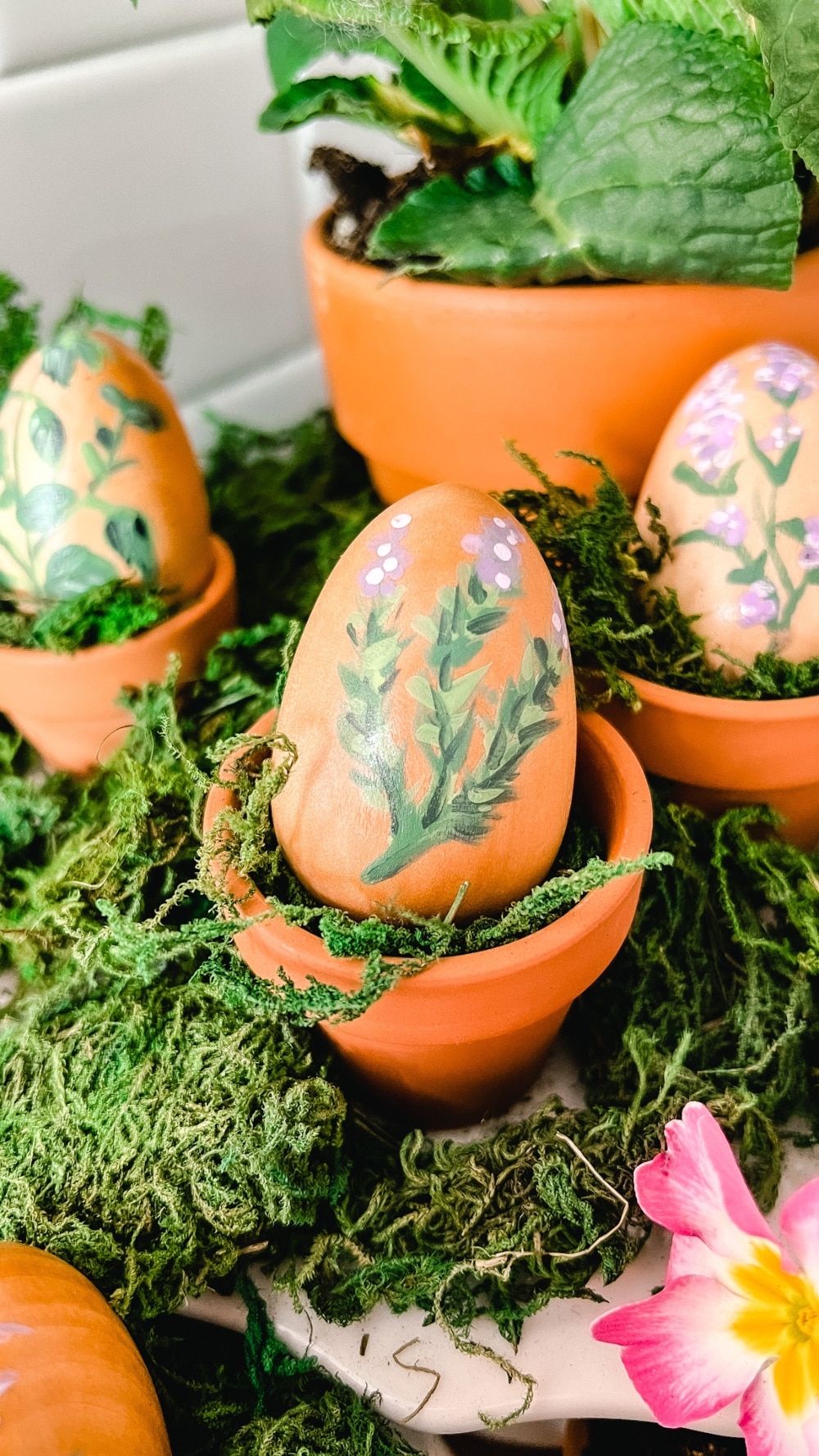 Hand Painted Herb Eggs Centerpiece. Create a sweet herb centerpiece by painting wooden eggs with different herbs!