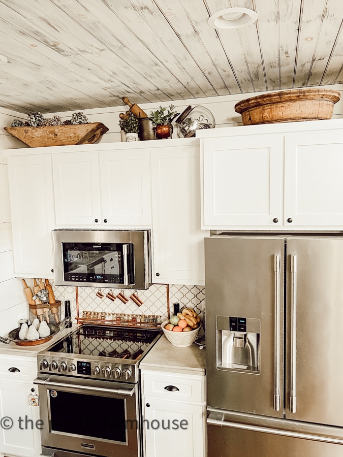 Looking for ideas on how to decorate above kitchen cabinets with a modern farmhouse style? Rachel shares tips for creative decorating using collectibles and more.