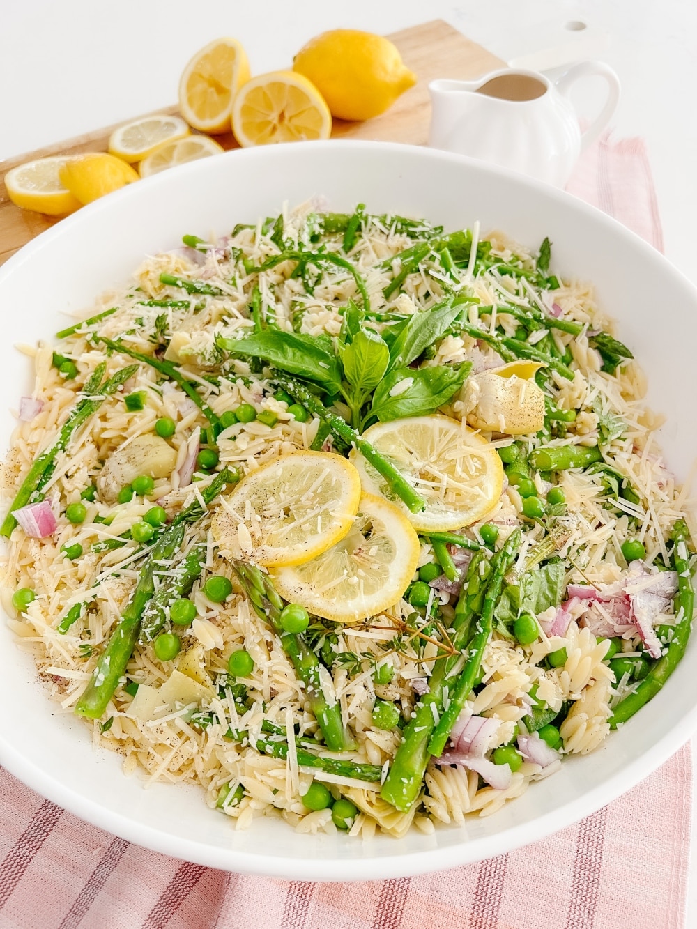 Lemon Orzo Pasta Salad. Celebrate warmer weather with this fresh orzo salad filled with summer vegetables and a fresh and light lemon herb vinaigrette dressing.