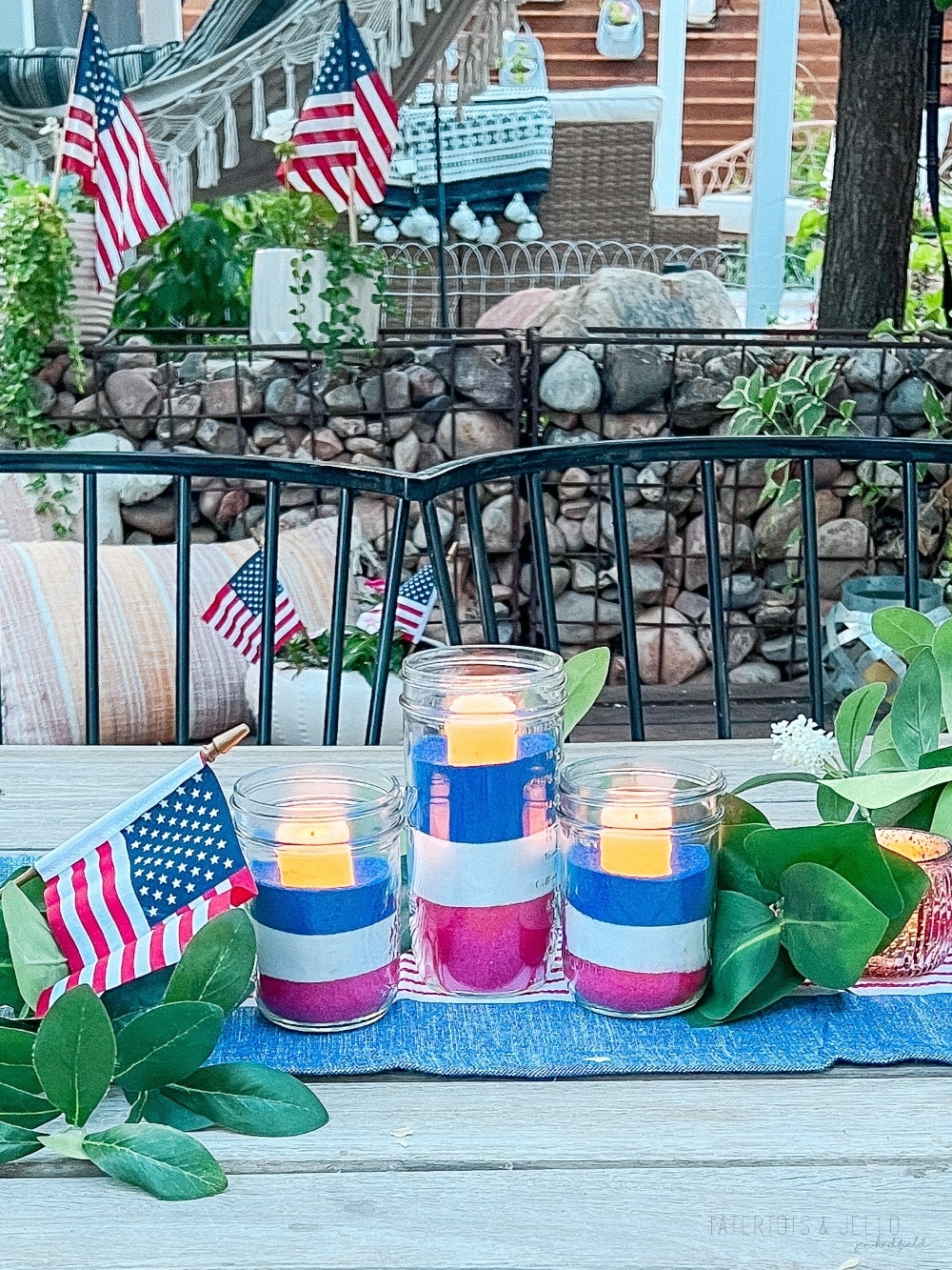 Easy Patriotic Candle Centerpiece. Celebrate summer by creating this simple layered sand centerpiece with battery-operated candles.