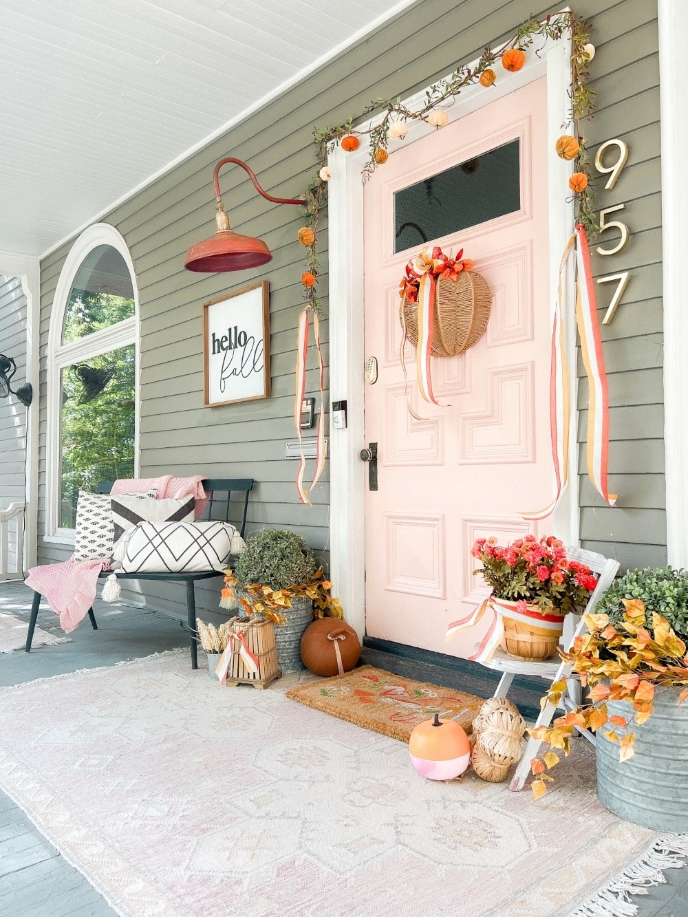 Embracing Autumn's Warmth: A Delightful Porch Transformation. Celebrate the crisp Fall season by incorporating a few simple items to transform your porch into a cozy Autumn haven. 