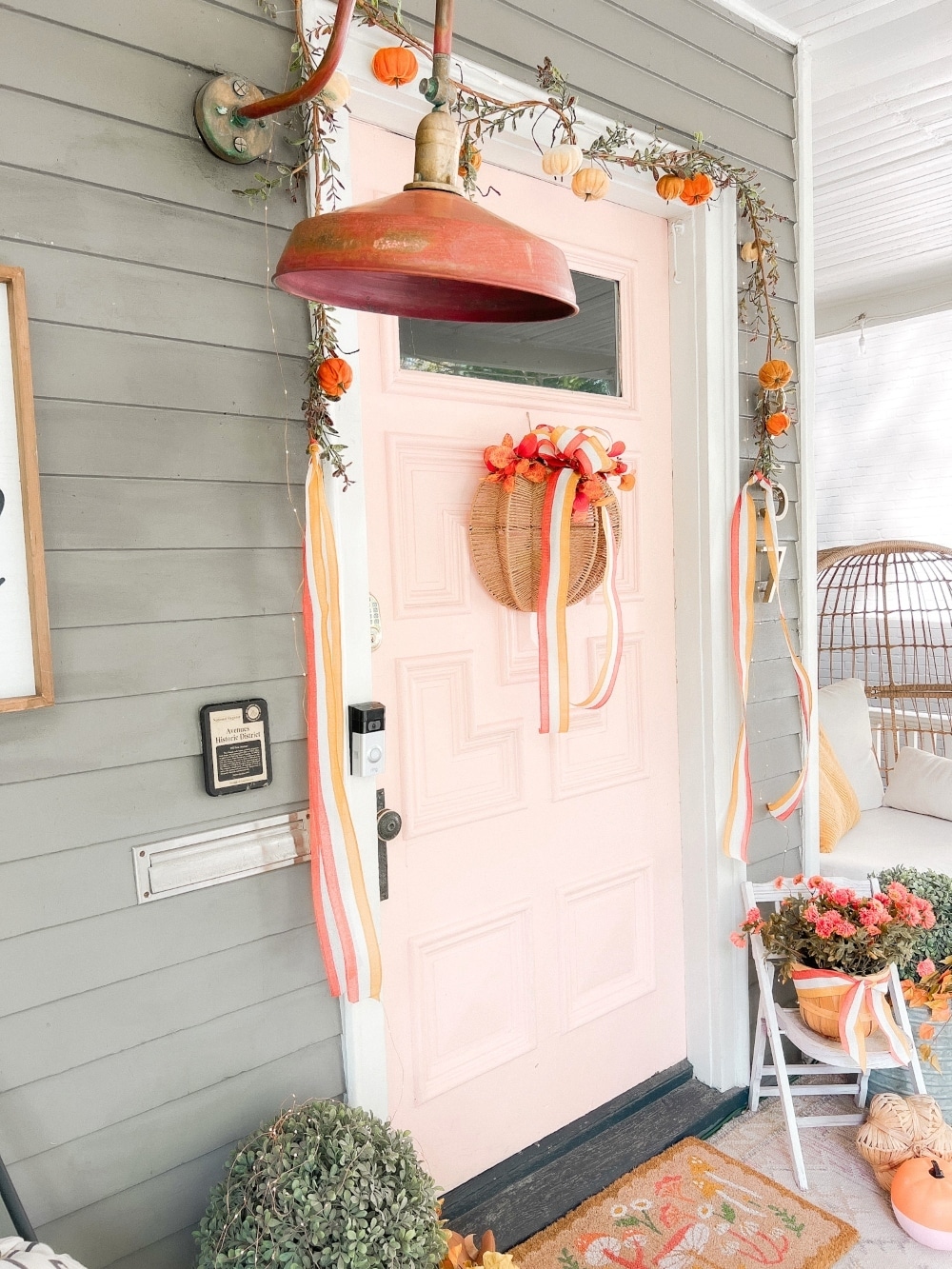 Embracing Autumn's Warmth: A Delightful Porch Transformation. Celebrate the crisp Fall season by incorporating a few simple items to transform your porch into a cozy Autumn haven. 