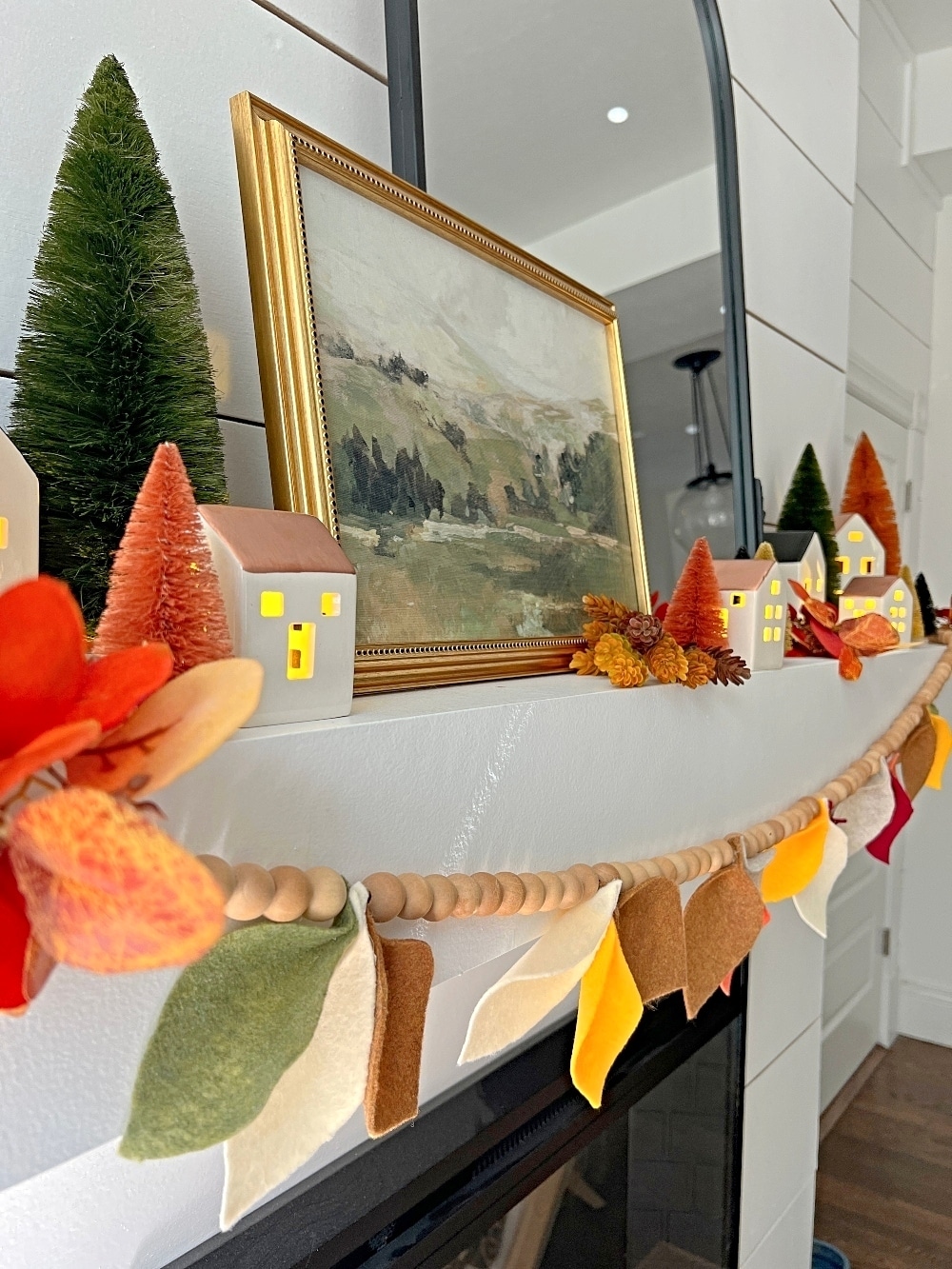 Fall Mantel and DIY Felt Leaf Garland. Get ready for fall with this cozy fall village mantel and DIY felt leaf garland!