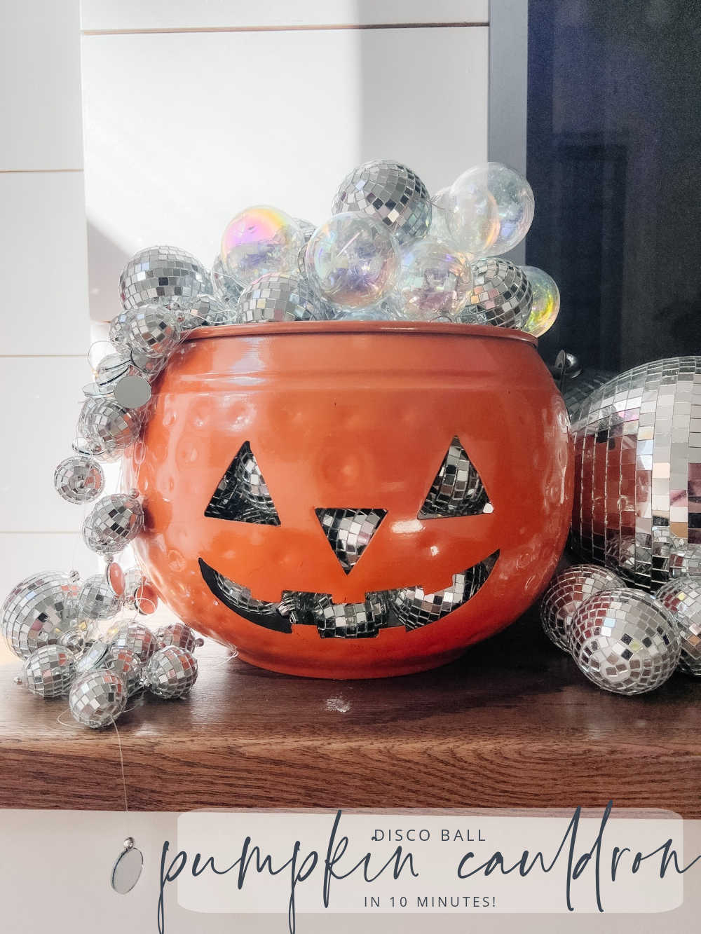 Disco Ball Lighted Halloween Pumpkin Cauldron. Transform your Halloween decor with this dazzling DIY disco ball lighted pumpkin cauldron. 