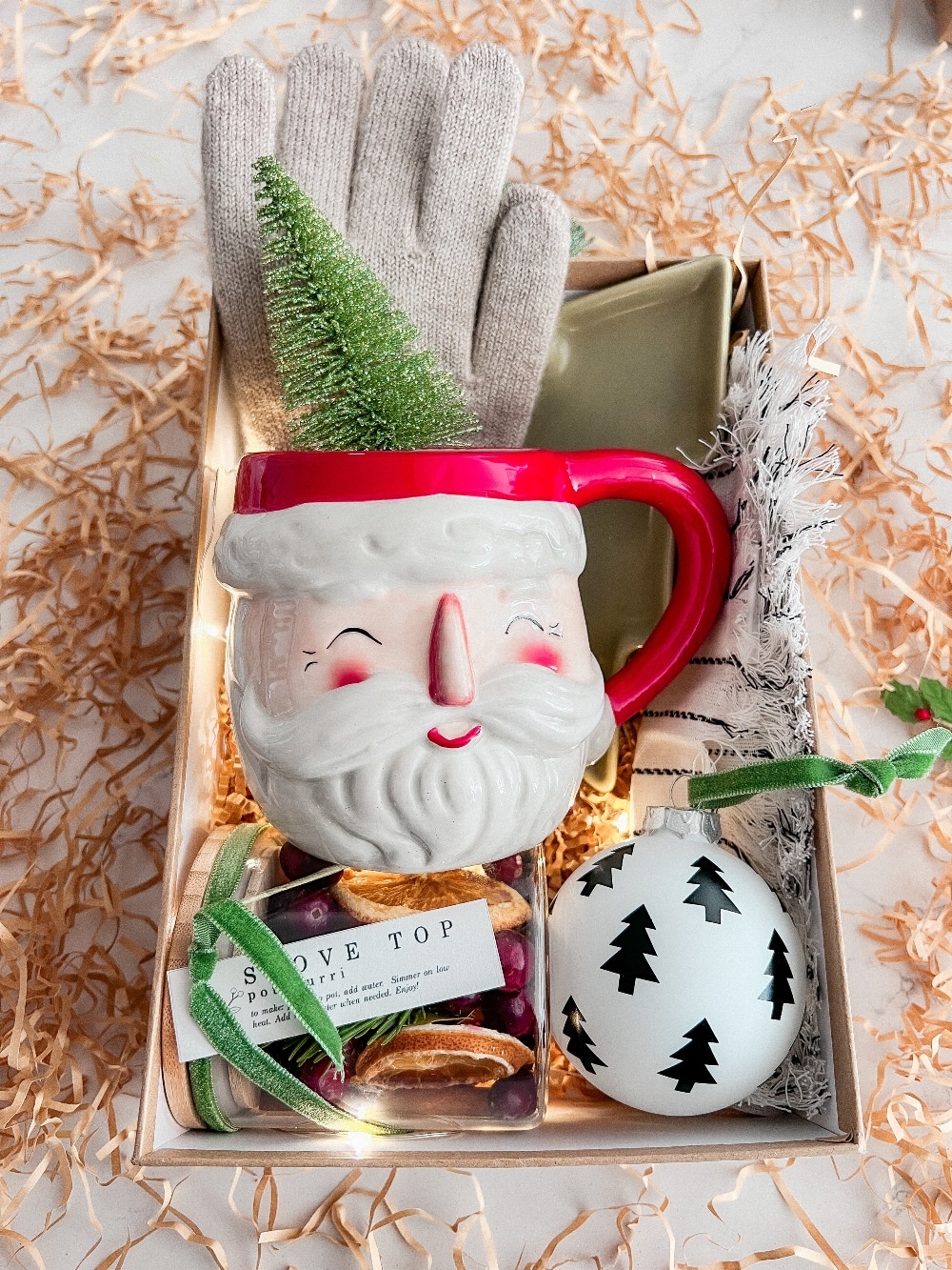 Warm and Cozy Hygge Christmas Gift Boxes. Gift your friends and neighbors with gift boxes full of warm and cozy items they can use this Christmas season! 