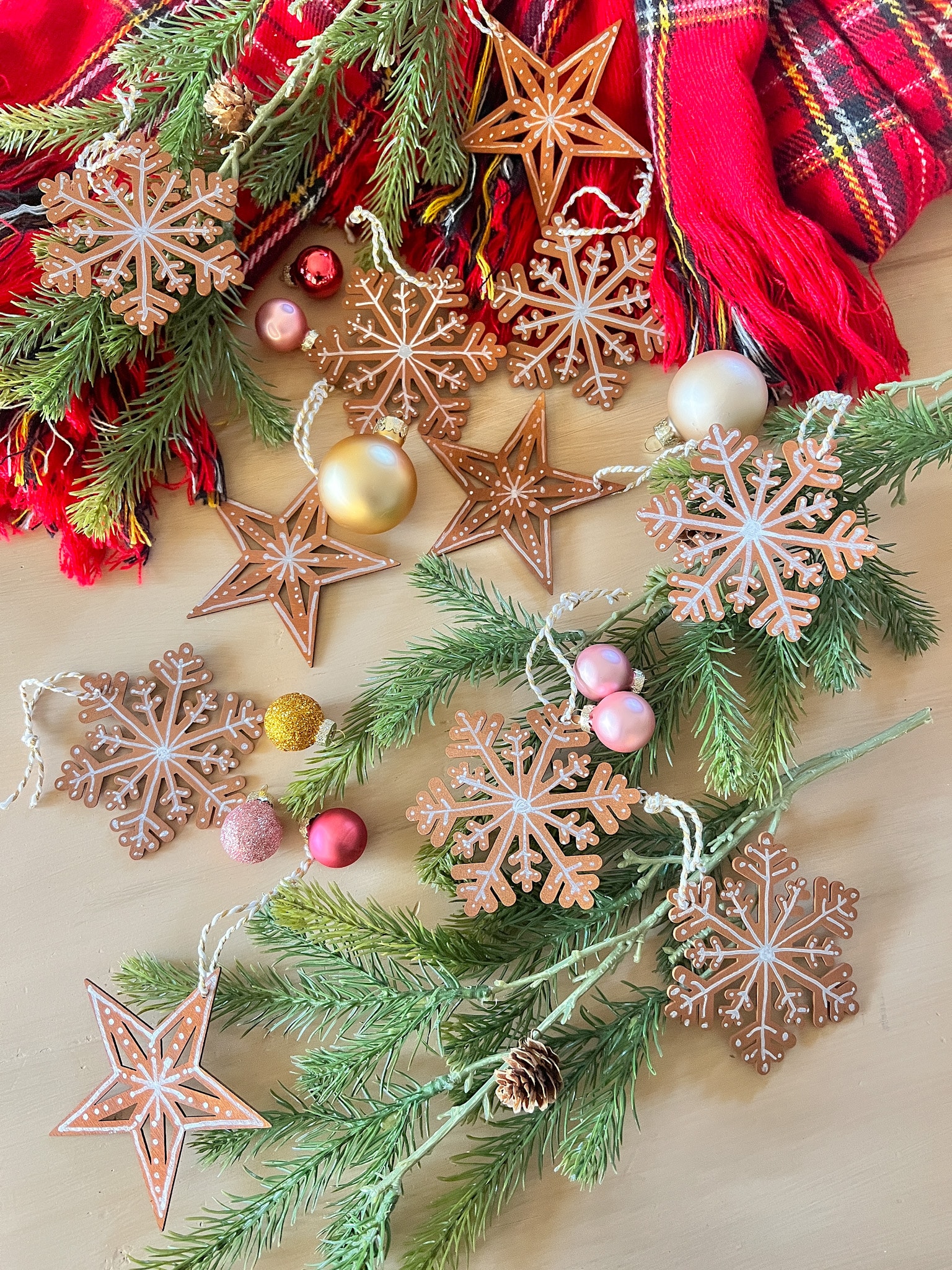 Paint Inexpensive Wooden Snowflakes to Look Like Gingerbread Cookies