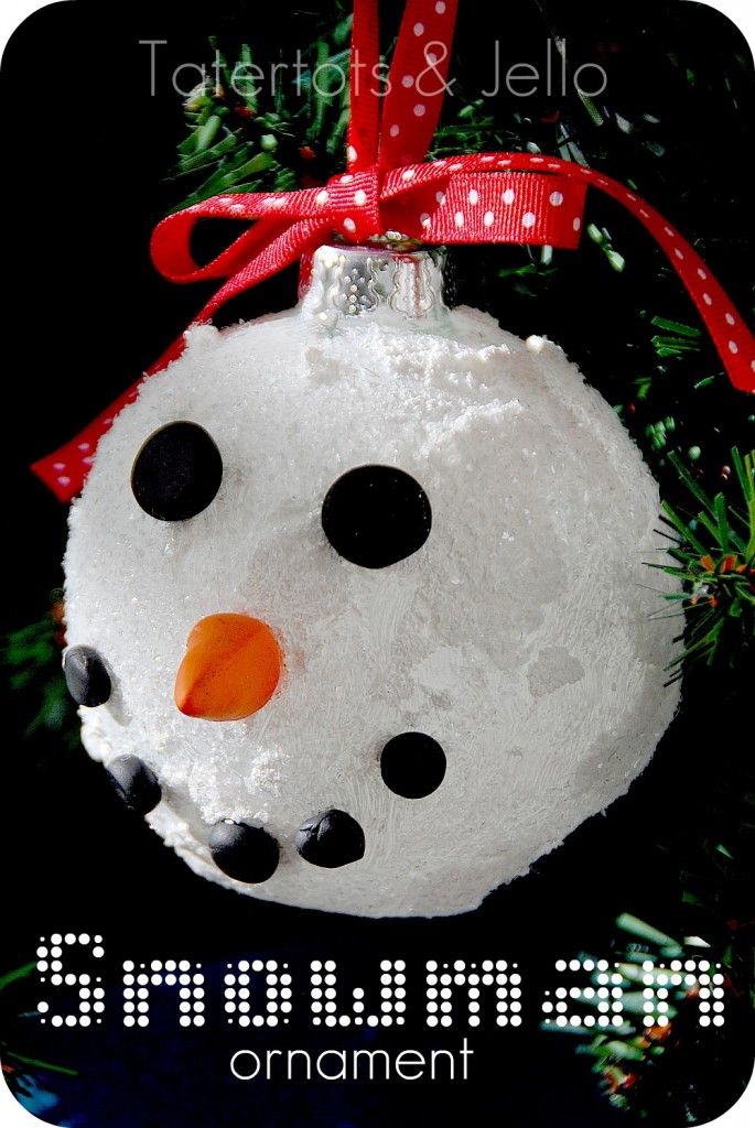 Keep the kids entertained with these adorable snowman ball ornaments. Using clay to sculpt the carrot nose, these ornaments add a touch of whimsy to your holiday decor. It's a perfect activity for a cozy family night by the fireplace.