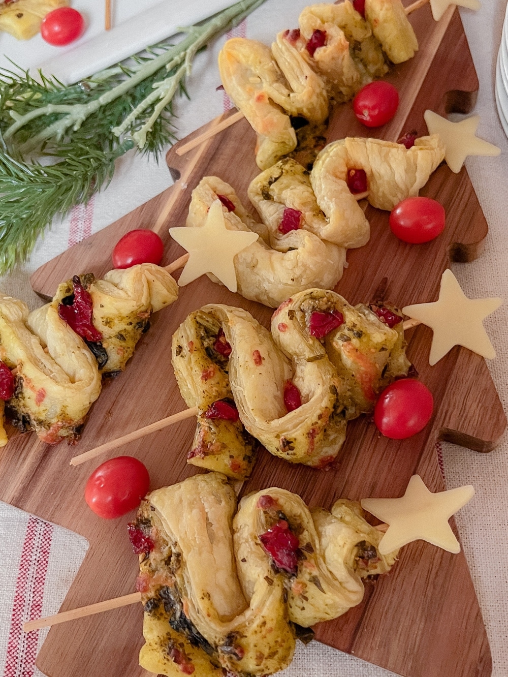 Savory Puff Pastry Pesto Tree Appetizer. Effortlessly elevate your holiday spread with the easy yet upscale Savory Puff Pastry Pesto Tree, boasting flaky layers, basil pesto, sun-dried tomatoes, and a classy cheesy star.