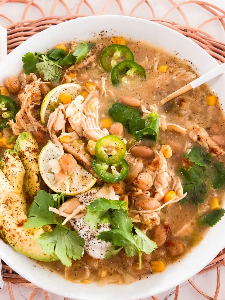 Warm Up Your Winter with Hearty 3-Bean White Chicken Chili in the Crockpot. The perfect soup to make this winter!