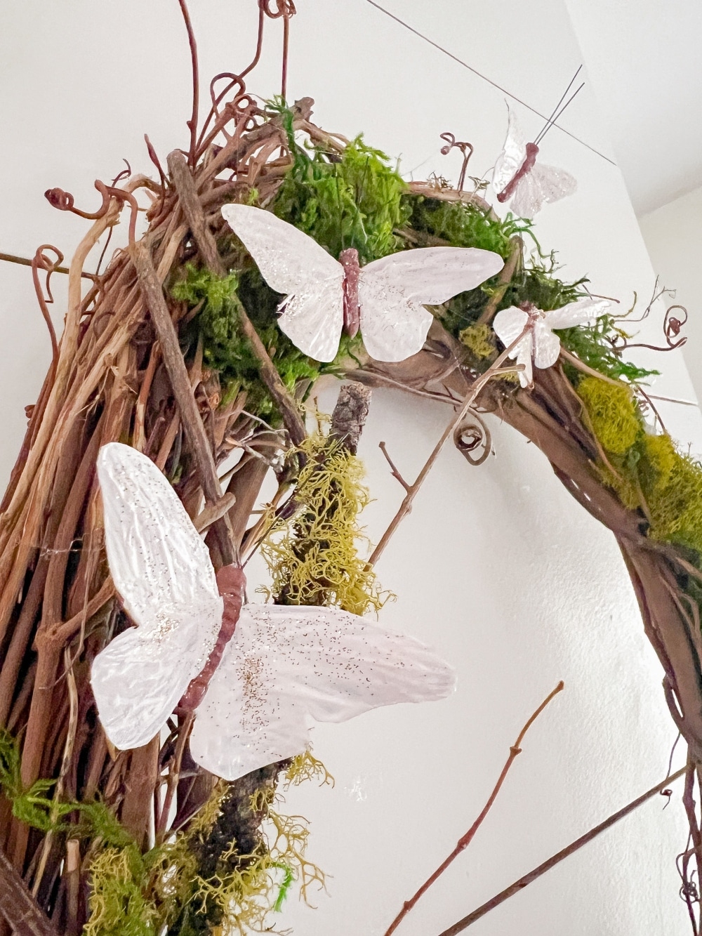 Spring Moss and Butterfly Wreath. Learn how to create a charming Spring Moss and Butterfly Wreath, perfect for welcoming the season with its rustic elegance and whimsical flair, plus 5 other DIY spring wreaths!  
