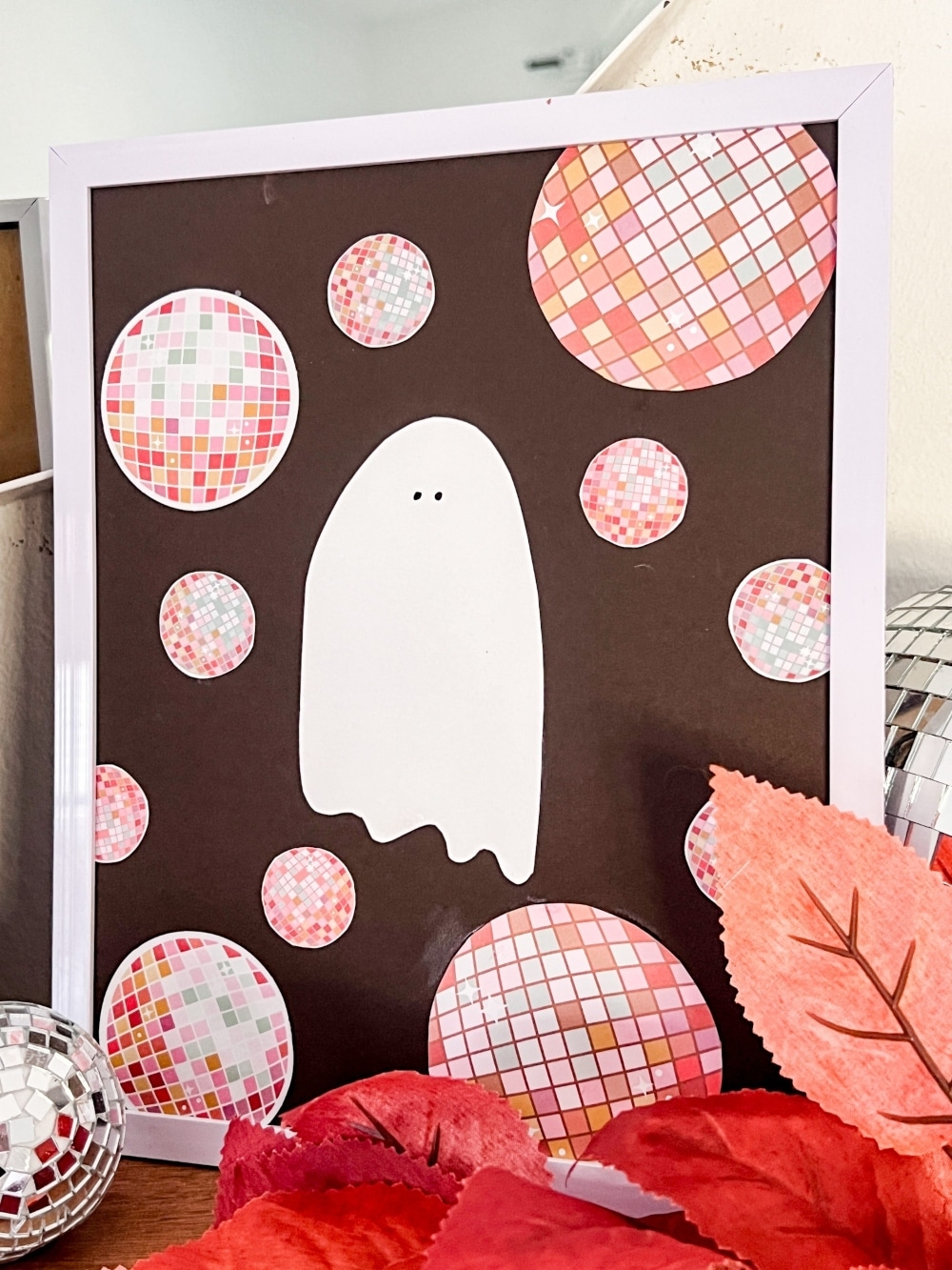 DIY Disco Halloween Art Using Scrapbook Paper. Create festive DIY disco-themed Halloween art using the scrapbook paper with these easy-to-follow steps for three spooky cute framed pieces.