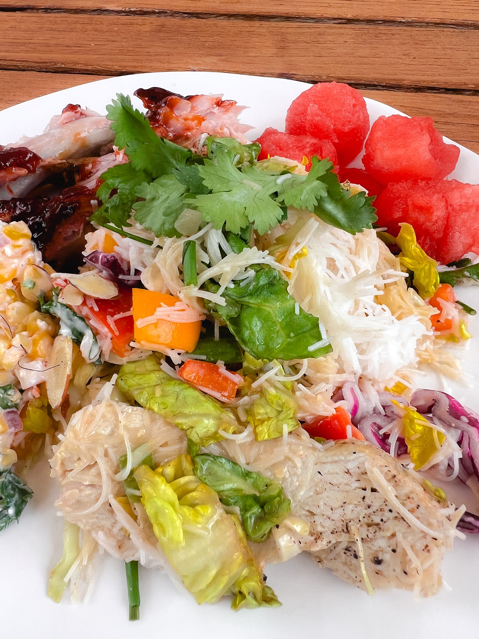 Summer Thai Chicken Noodle Salad Recipe. Thai Chicken Noodle Salad is a colorful medley of seasoned chicken breast, crunchy bell peppers, crisp cabbage, and tender rice noodles, all tossed in a rich, tangy peanut dressing.