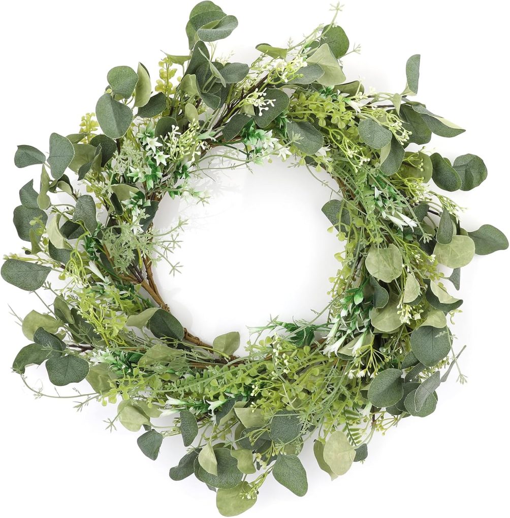 Summer greenery wreath with small white flowers 