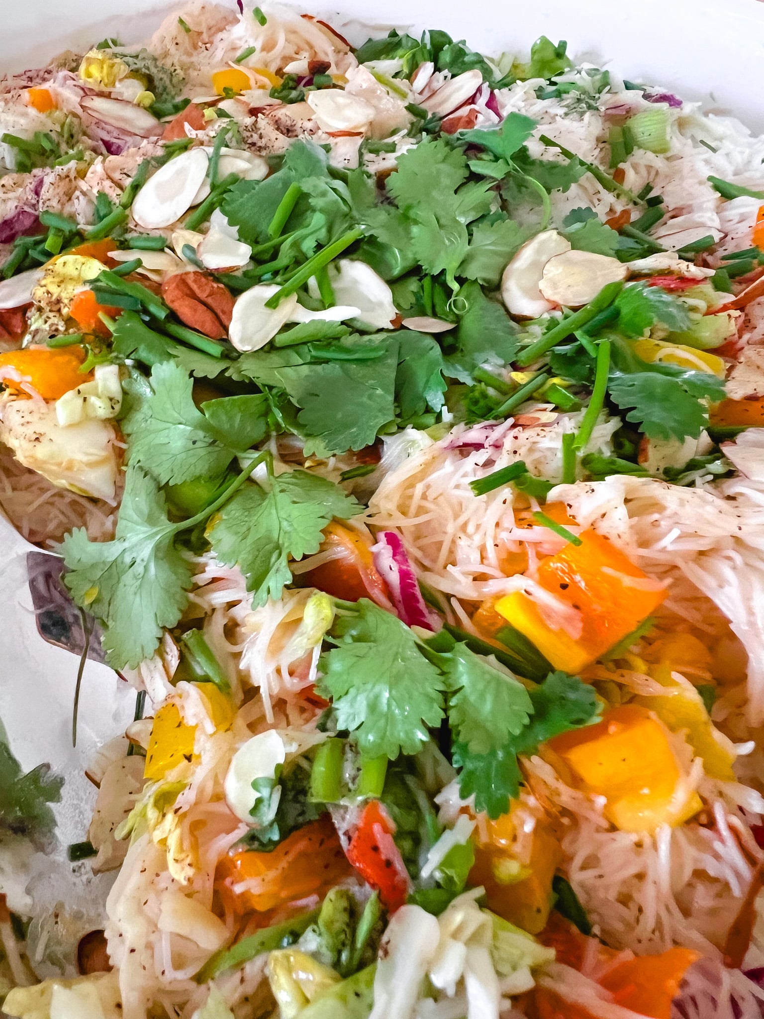 Summer Thai Chicken Noodle Salad Recipe. Thai Chicken Noodle Salad is a colorful medley of seasoned chicken breast, crunchy bell peppers, crisp cabbage, and tender rice noodles, all tossed in a rich, tangy peanut dressing.