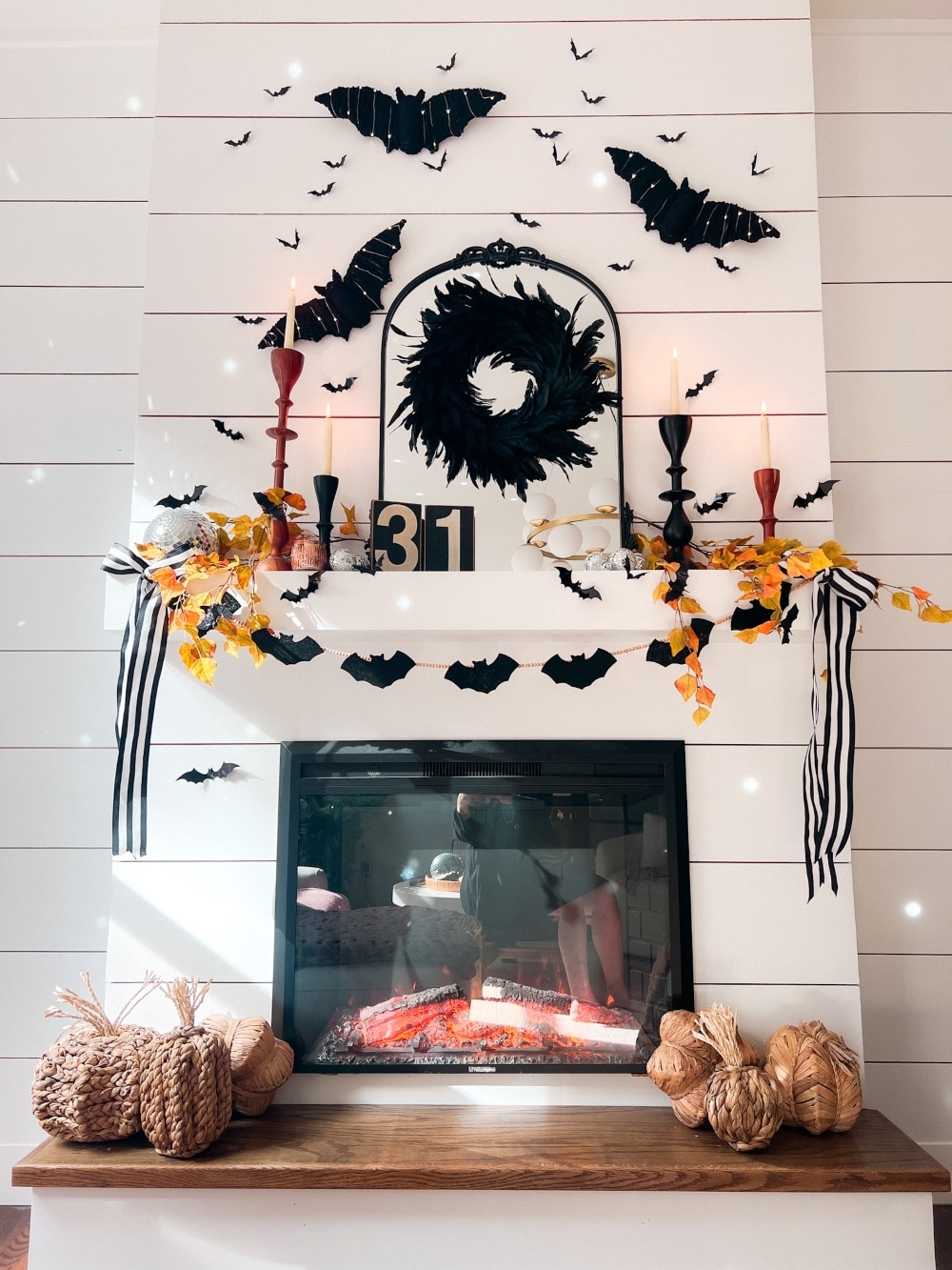 DIY Halloween Bat Mantel Ideas. DIY ideas for creating a stylish bat-themed Halloween mantel using budget-friendly decorations like Pottery Barn-inspired bats, bat garlands, disco balls, and natural fall elements.