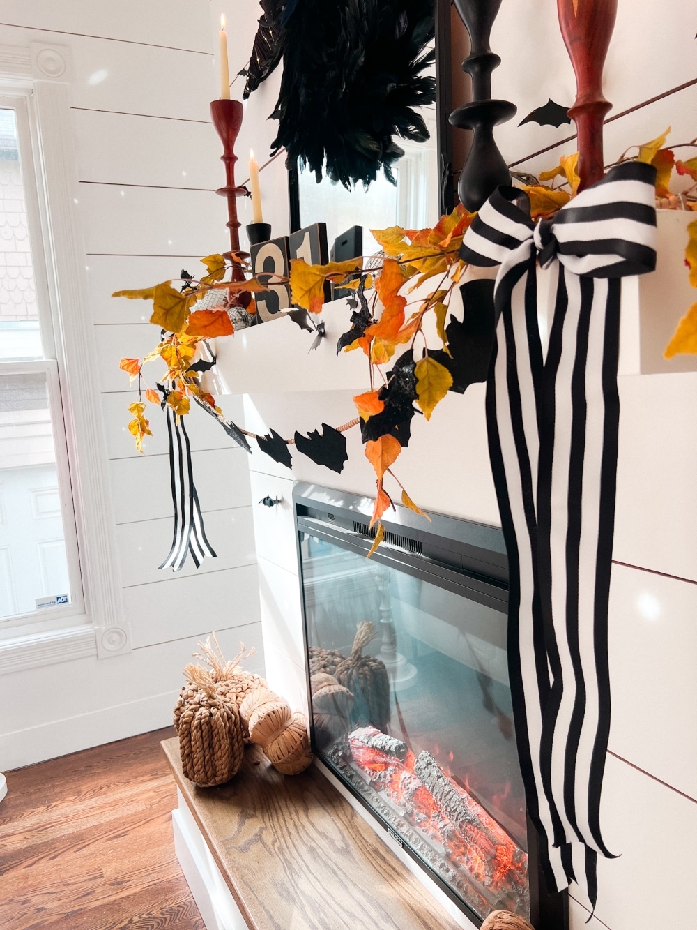 DIY Halloween Bat Mantel Ideas. DIY ideas for creating a stylish bat-themed Halloween mantel using budget-friendly decorations like Pottery Barn-inspired bats, bat garlands, disco balls, and natural fall elements.