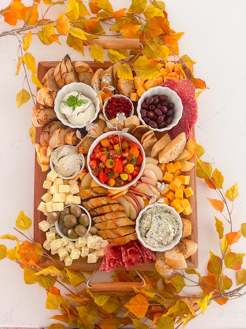 Fall Bruschetta Charcuterie Board. How to create a Fall Bruschetta Party Board featuring grilled baguette slices, a fresh bruschetta topping, and a variety of toppings for a fun and flavorful autumn gathering. 