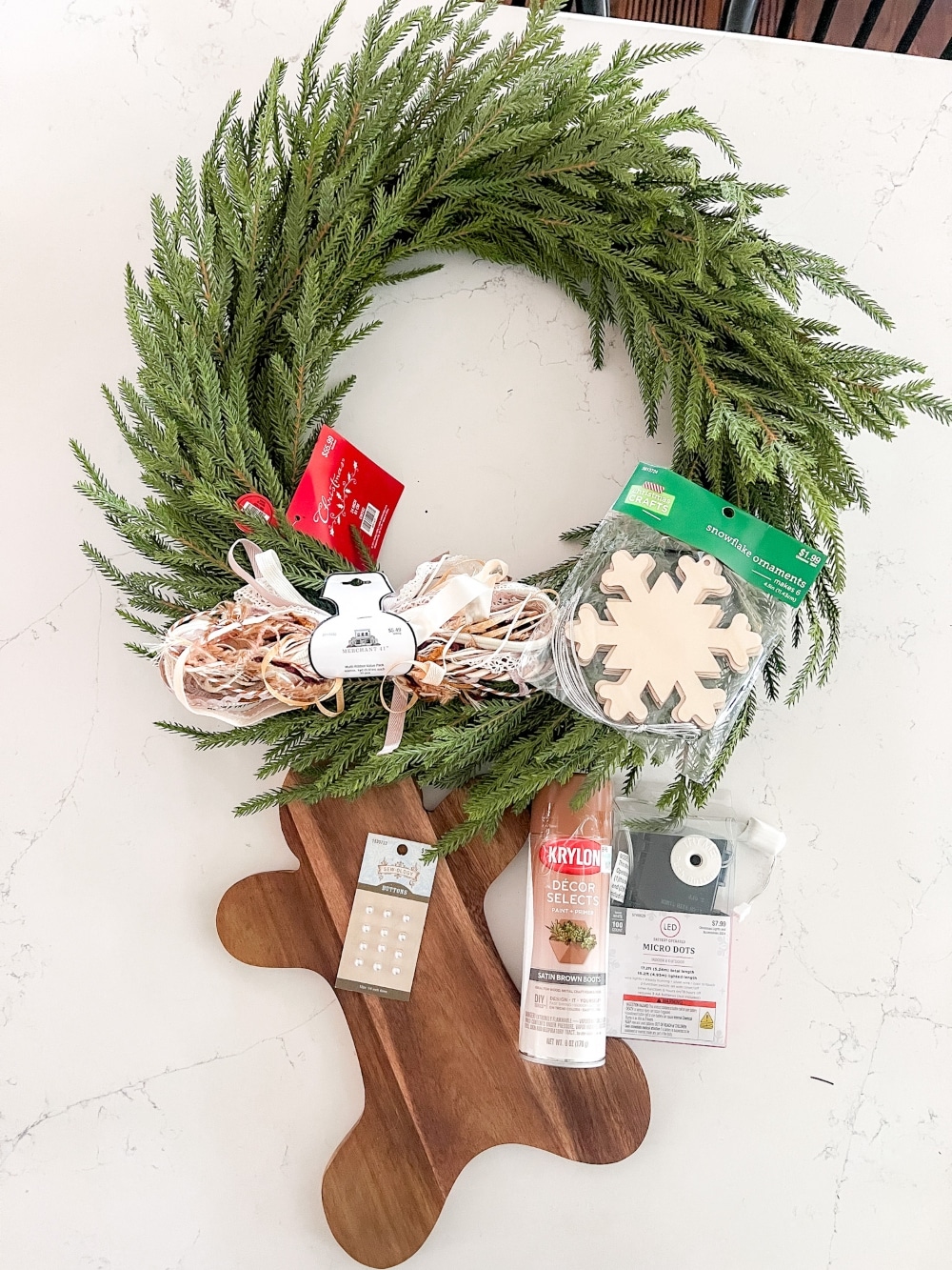 DIY Gingerbread Christmas Wreath. Create a whimsical gingerbread-themed Christmas wreath in just a few simple steps with this easy DIY tutorial!