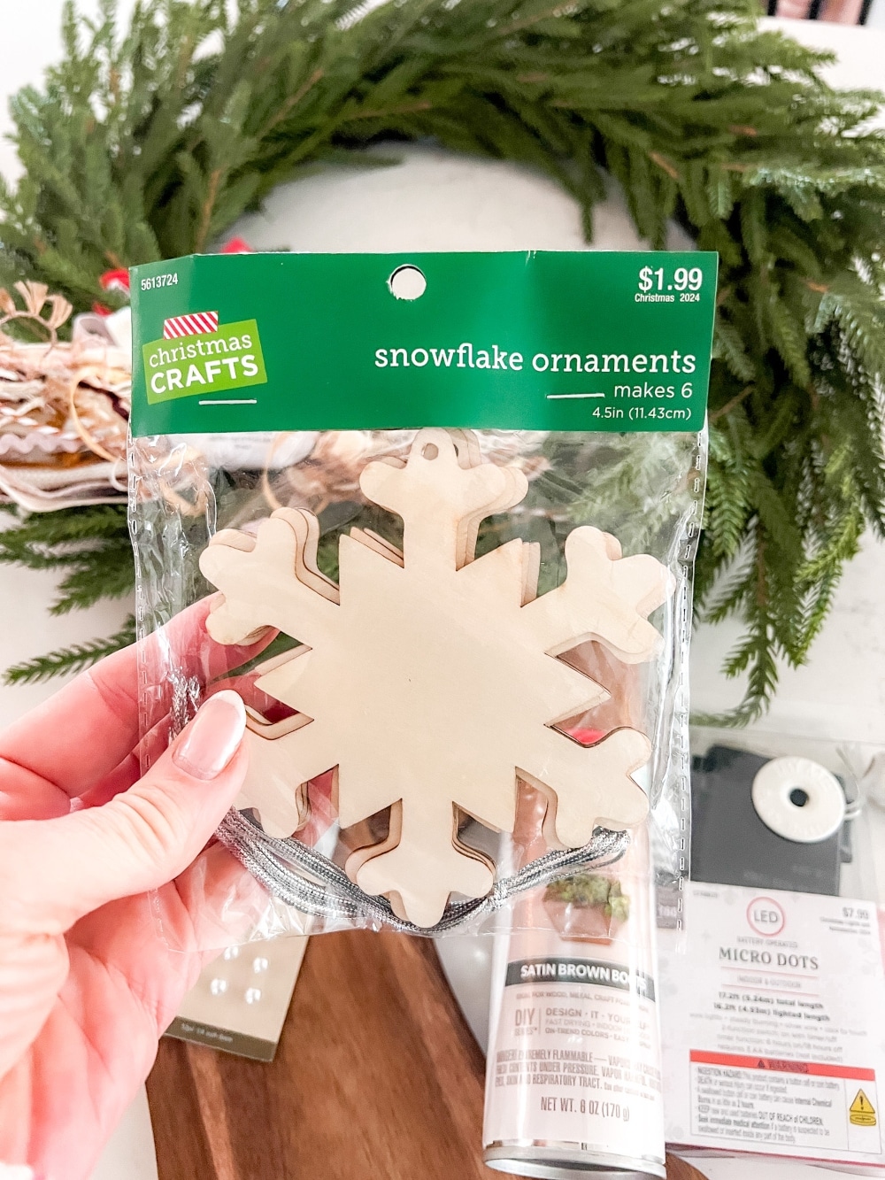 DIY Gingerbread Christmas Wreath. Create a whimsical gingerbread-themed Christmas wreath in just a few simple steps with this easy DIY tutorial!