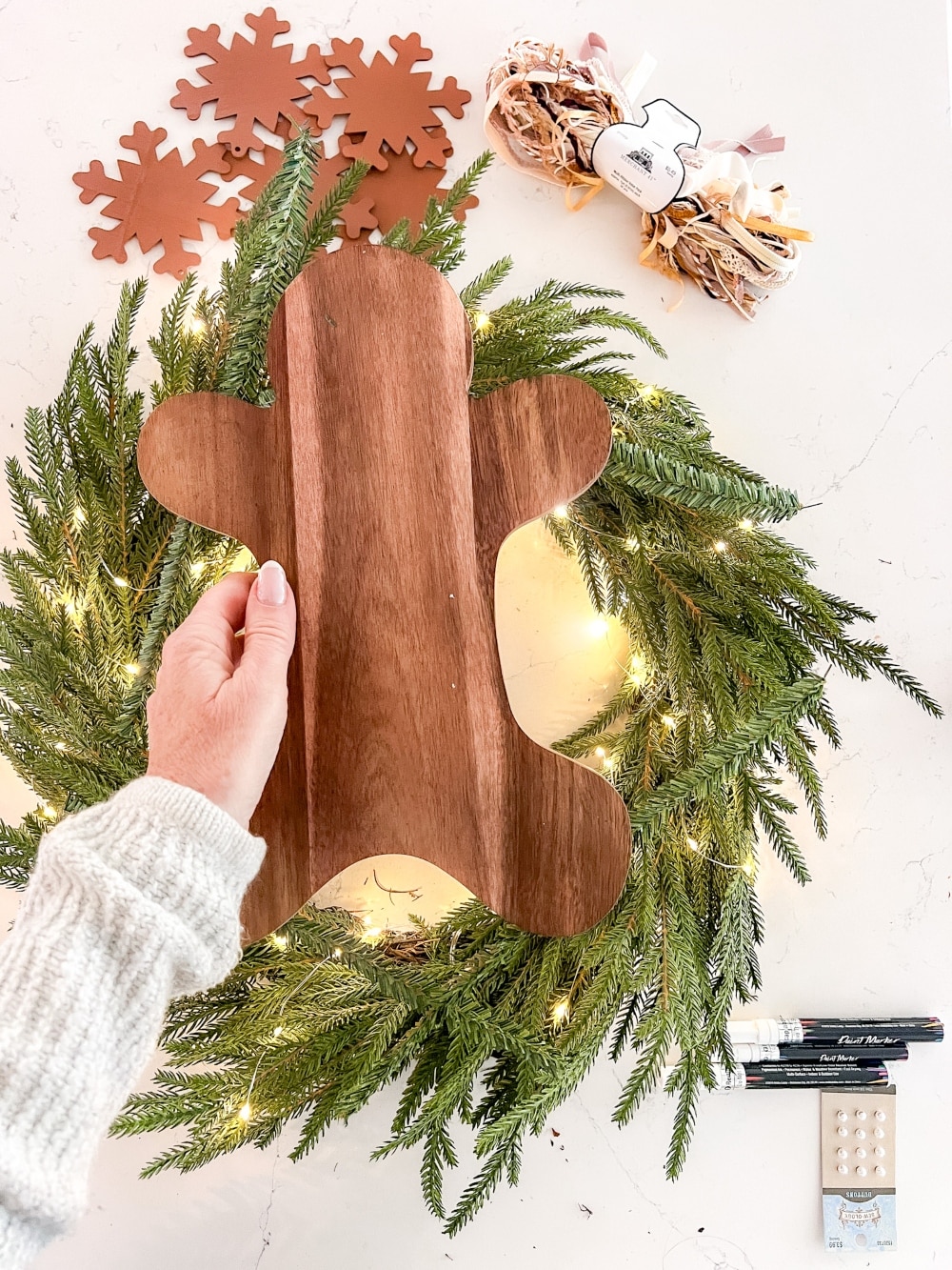 DIY Gingerbread Christmas Wreath. Create a whimsical gingerbread-themed Christmas wreath in just a few simple steps with this easy DIY tutorial!