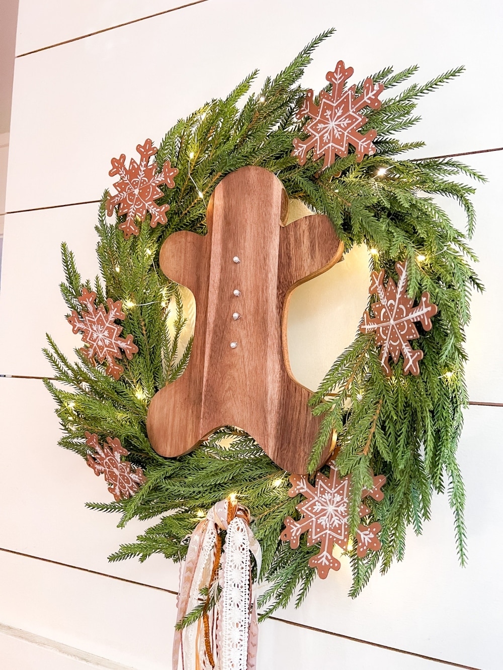 DIY Gingerbread Christmas Wreath. Create a whimsical gingerbread-themed Christmas wreath in just a few simple steps with this easy DIY tutorial!