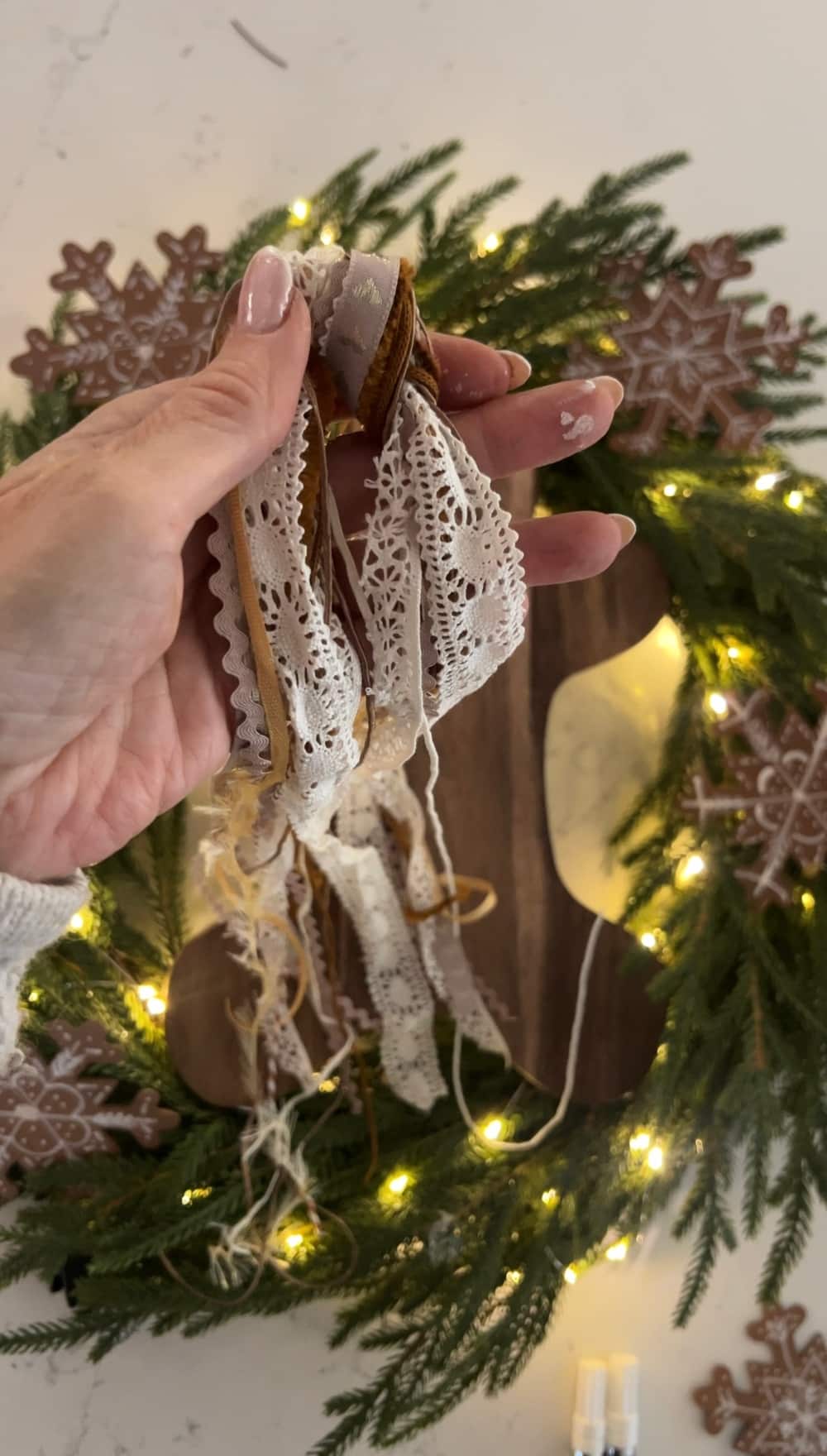 DIY Gingerbread Christmas Wreath. Create a whimsical gingerbread-themed Christmas wreath in just a few simple steps with this easy DIY tutorial!