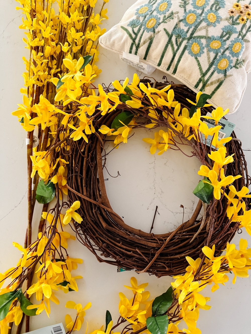 DIY Forsythia Spring Porch! Create a fresh and welcoming spring porch in minutes with vibrant forsythia faux florals, a DIY wreath, a teapot planter and cheerful accents!