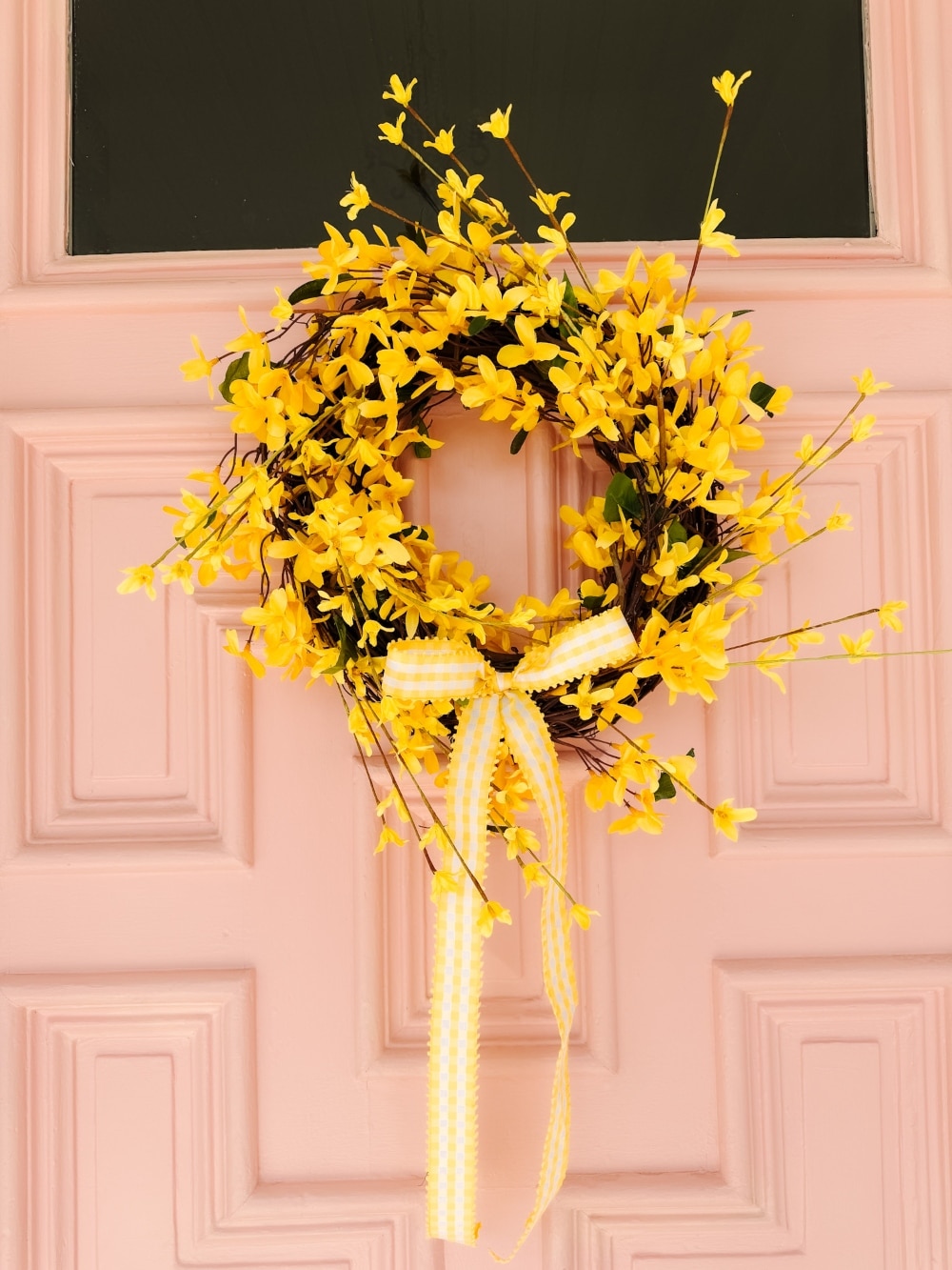 DIY Forsythia Spring Porch! Create a fresh and welcoming spring porch in minutes with vibrant forsythia faux florals, a DIY wreath, a teapot planter and cheerful accents!