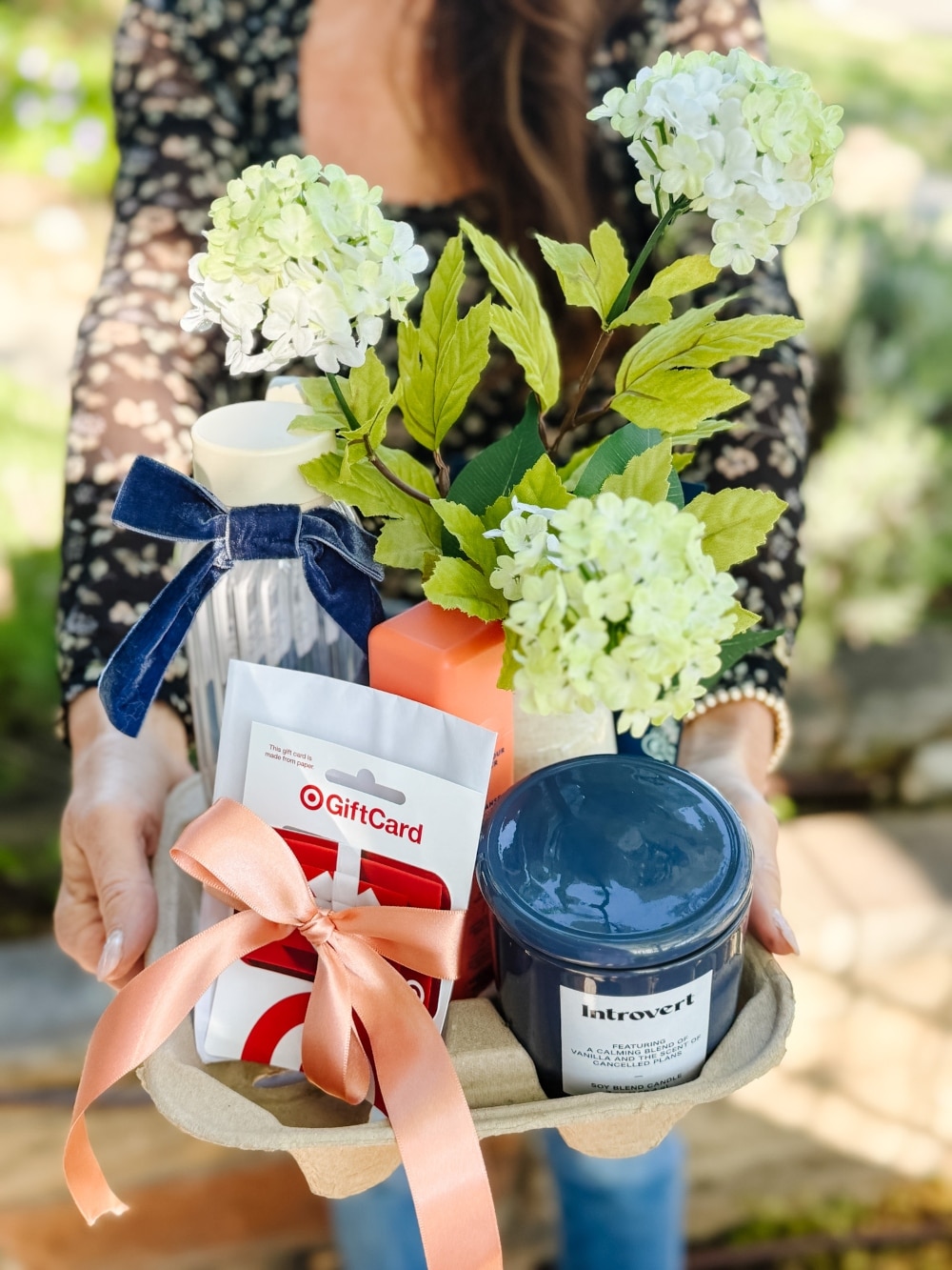 Mother's Day Cup Holder Gift Basket. Transform a simple drink carrier into a delightful Mother’s Day gift basket by filling each cup slot with thoughtful little surprises for the moms, grandmas, and mom friends who fill your life with love.