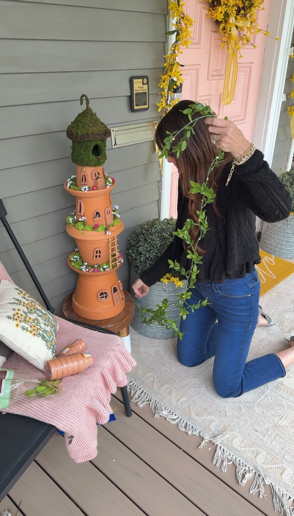 DIY Terra Cotta Pot Fairy Garden – A Magical Spring Craft. Create a whimsical stacked terra cotta fairy garden with clay doors, moss, and magical miniatures to add charm to your spring porch!